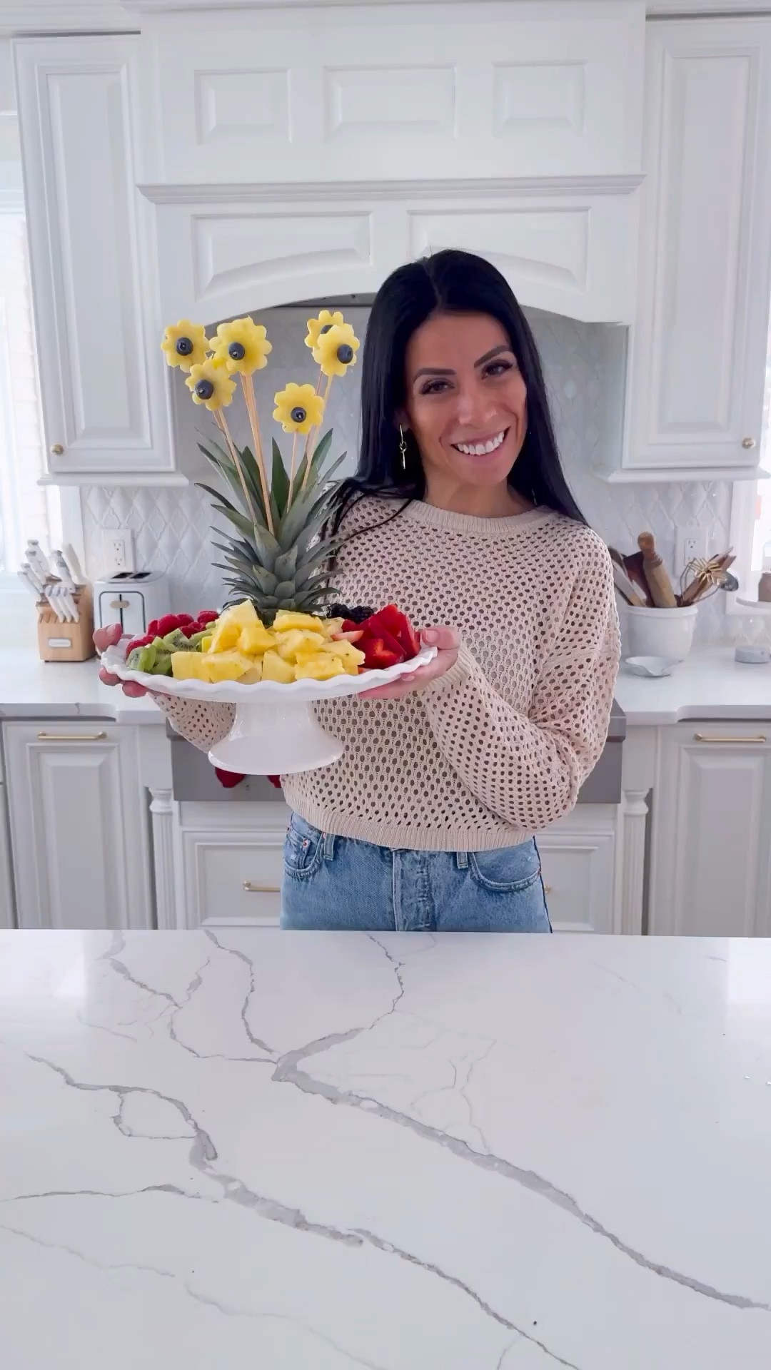 Spring Fruit bouquet! A great and delicious centerpiece for Easter, Mother’s Day or a Spring brunch! 

Linked below are the tools I used and what you will need:

• one pineapple with healthy crown  (cut the head and pass it through faucet hot water quickly to ensure the green are bright)
• blueberries to make the éter of the flowers
• other fruit of choice. whatever is in season but I like to make sure I add color so keep that in mind (you can also use the flower cutters to cut the fruit in flower shapes
• skewers and toothpicks cut in 3’s  (the toothpicks will help you hold the blueberry to the pineapple flower)
• platter or cake stand 
• a good knife! (The one linked here is phenomenal to cut fresh fruit!)
Cut the head of the pineapple and place it on a platter or cake stand. Cut the pineapple in slices about 1” thick. Cut with the flower cutter. Add the blueberry in the middle of the flower placing a toothpick cut in 3’s. Add the flower to the skewer and poke it in the crown of the pineapple. Repeat until you form the bouquet. Add fruit around it and enjoy! 

#LTKfoodie #LTKSeasonal