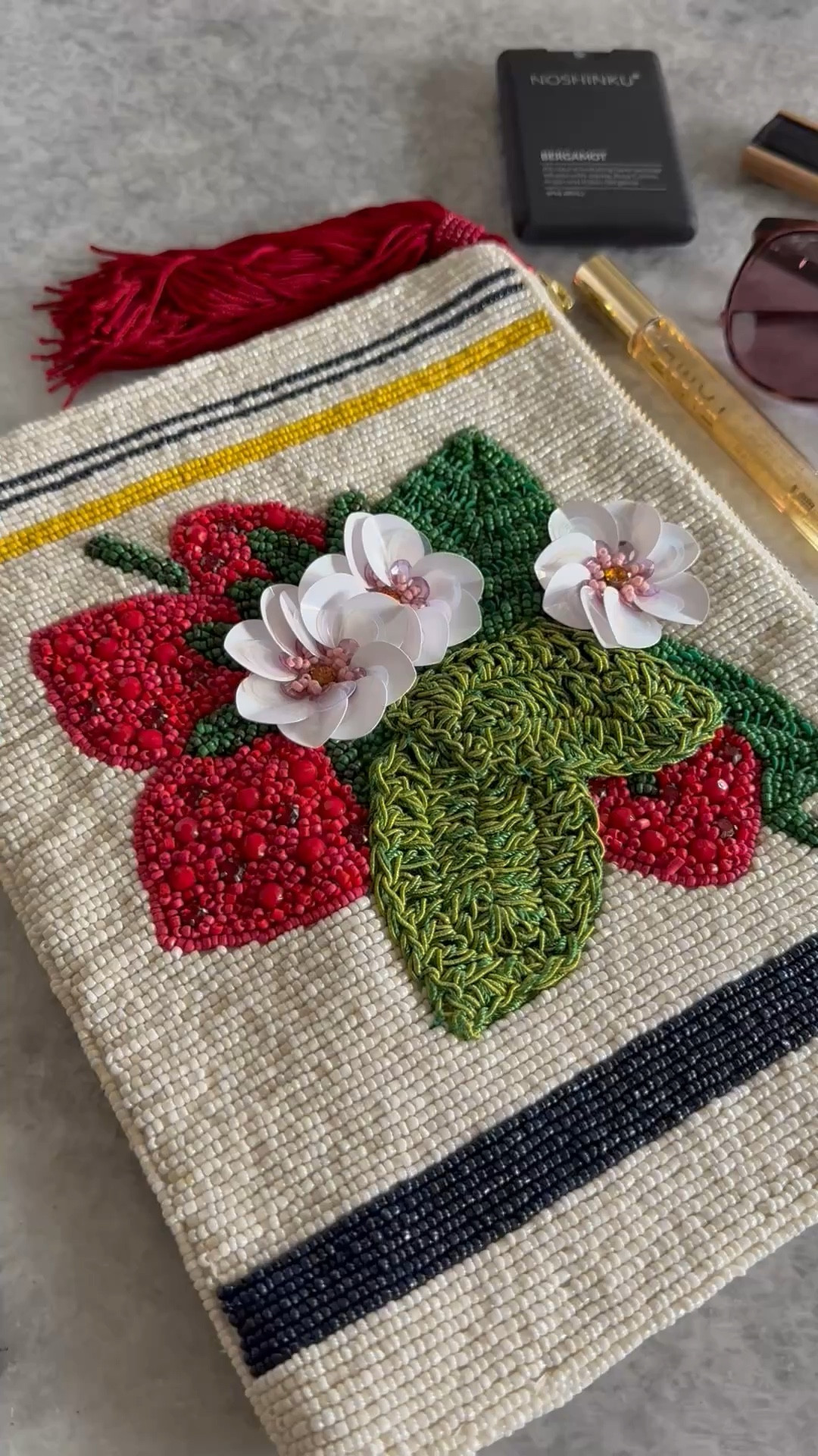 What I have in my large beaded, pouch. Bergamot hand sanitizer, travel perfume, YSL matte lipstick, Maui Jim sunglasses, & a bamboo hand fan 🪭 

My sunglass frames are: Tortoise with Raspberry. Lens: Maui Rose®️

#LTKSeasonal #LTKBeauty #LTKItBag