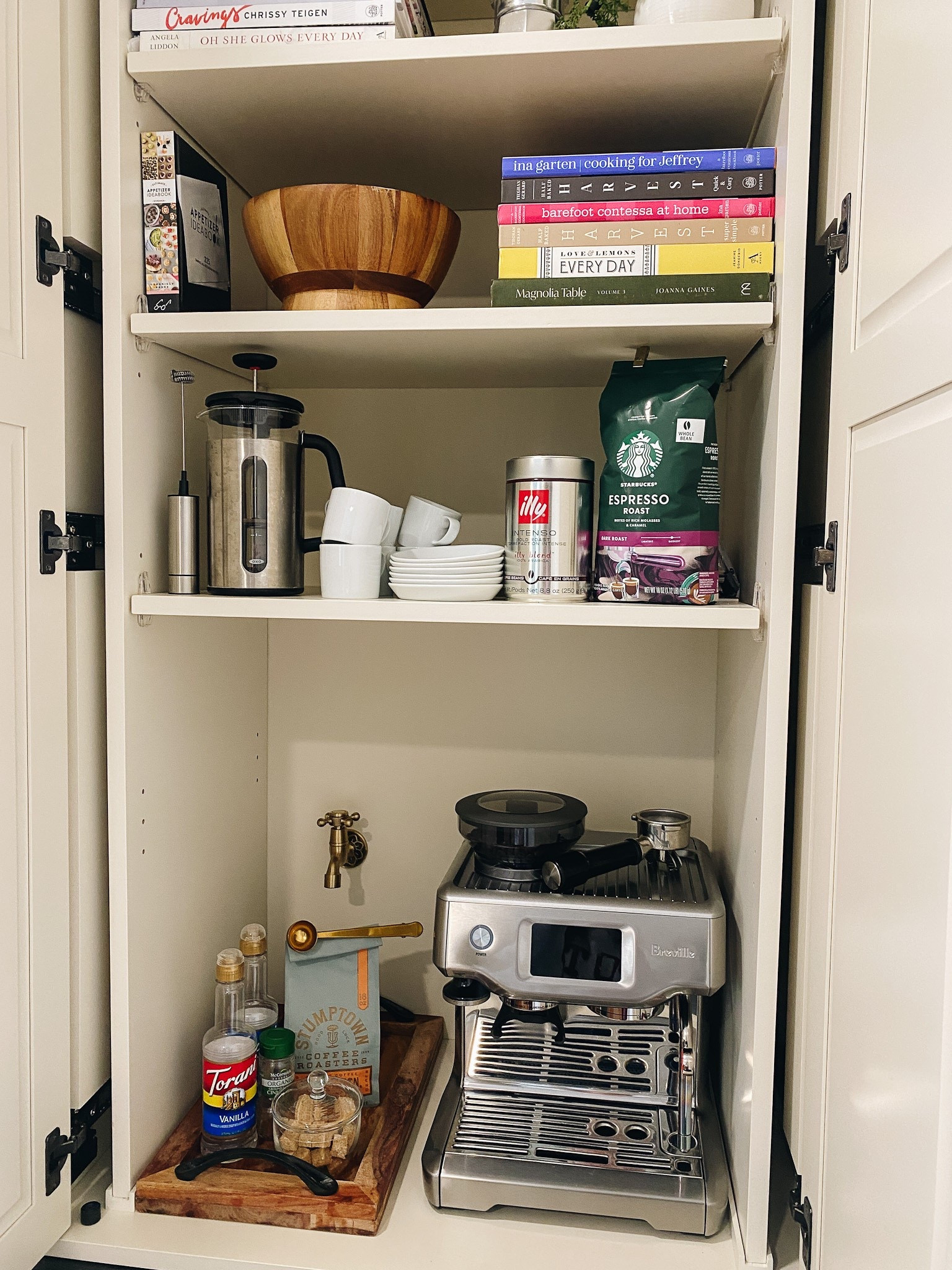 When drawing out the new floor plan for our kitchen that we recently renovated, creating a cabinet coffee station was at the very top of my list.  I wanted a space where I could keep everything conveniently in one spot and easily tuck it all behind a door. Find all the details of how I designed mine in the post on my blog (link in bio!) 

 #cabinetcoffeebar #cabinetcoffeestation #cabinetcoffeedesign #kitchencoffeestation #coffeestationathome #homecoffeestation #hiddencoffeestation #LTKHome