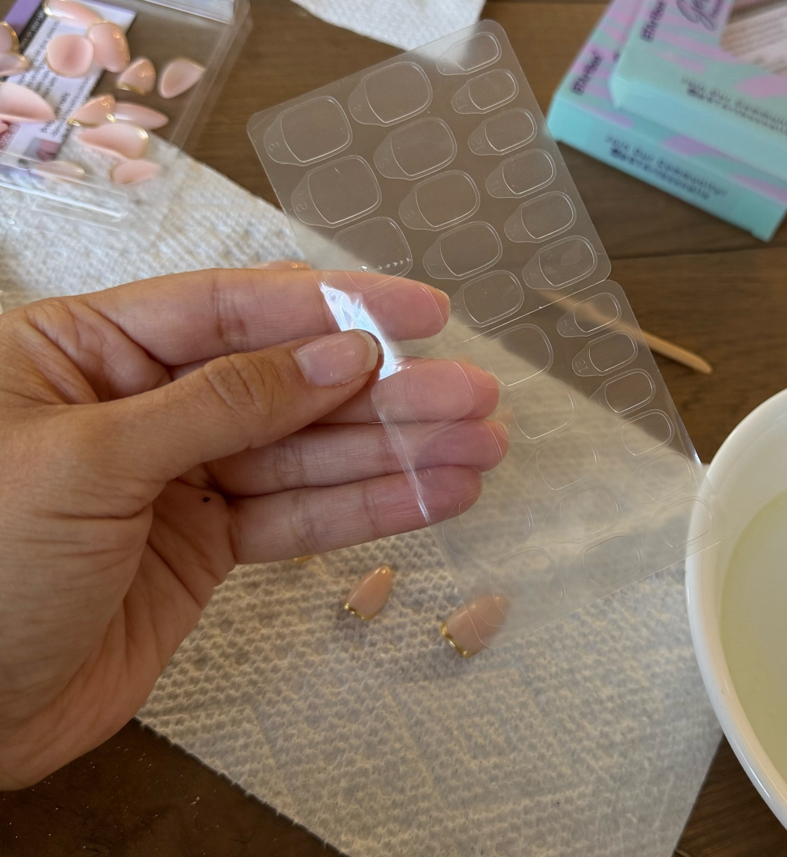 The adhesive tabs that keep your press on nails on for 2+ weeks! I soaked them off in warm water with dish soap, olive oil and olive oil. 

If you buy the press on nails the tabs come with them or you can use whatever brand nails you want and get these tabs 
