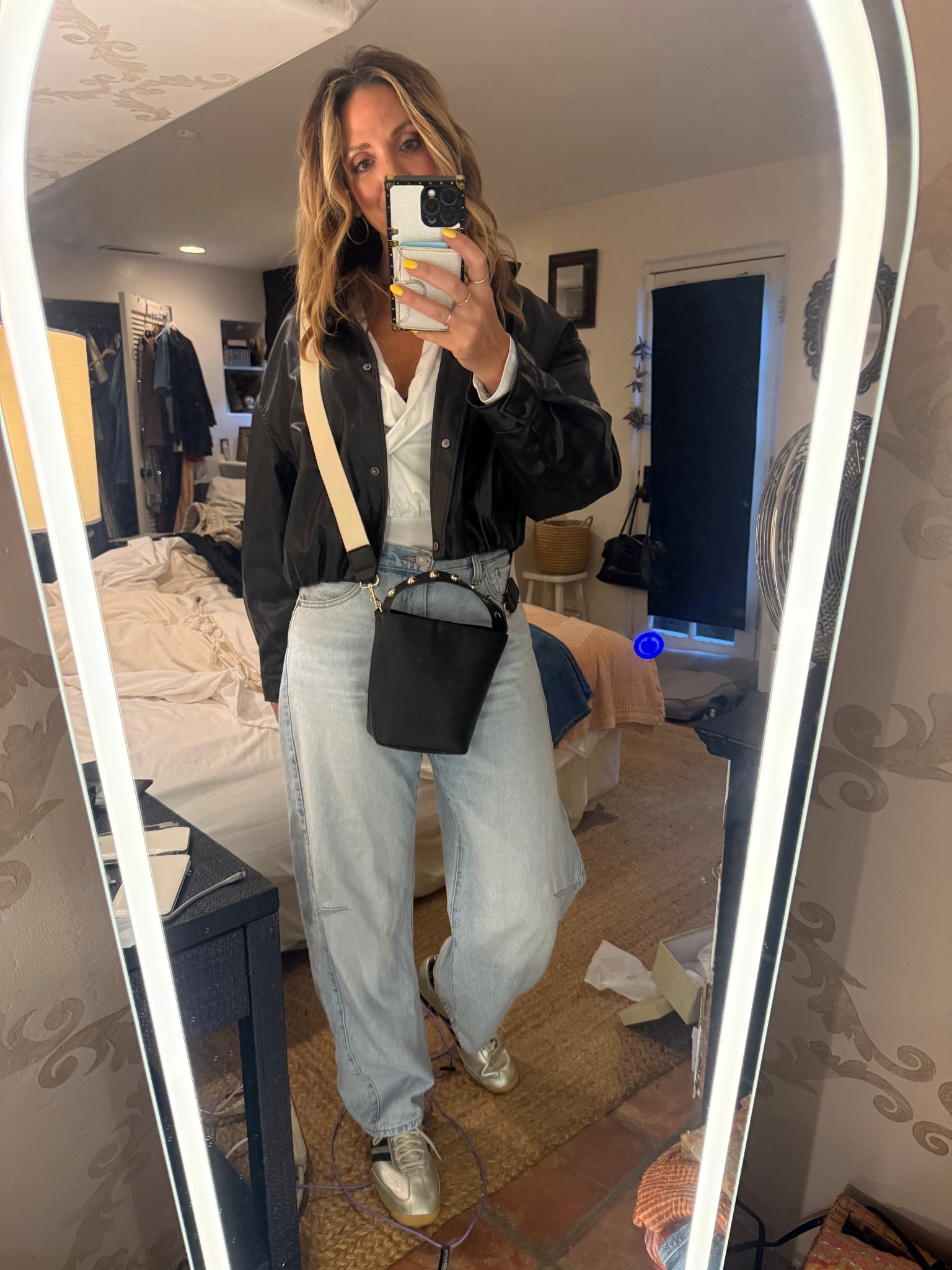 Concert night outfit but make it practical ✨
It turned into a chilly, drizzly spring evening, so I swapped my planned ballet flats for these super comfy metallic @adidas-and honestly, they made the whole look.

These @Levi's cinch waist barrel jeans are one of my most worn pieces (truly on repeat). They’re so easy to style—cardigans, cropped vests, tanks, sandals, sneakers, ballet flats…they just work every time.

Paired them with a faux leather cropped jacket from @Zara, & a long sleeve ruched bodysuit for that flattering, slightly elevated feel. And this mini bucket bag from @Target  with gold stud detail is such a fun little statement (also converts to crossbody 🙌).

This would be perfect for a spring concert, casual date night, or even styled lighter as we head into summer nights 🤍
