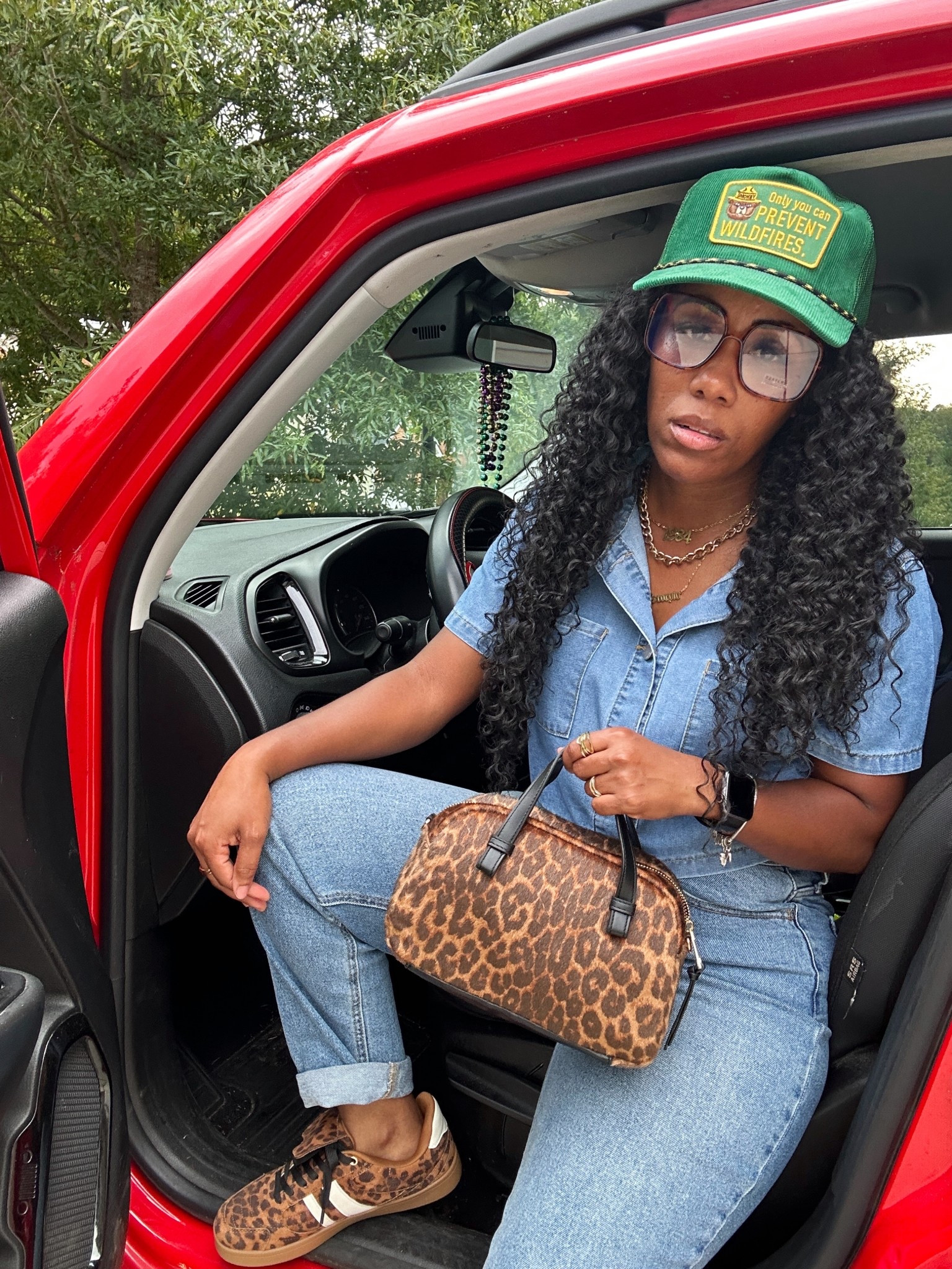 Denim on denim outfit idea. I’m wearing a denim cropped button up short sleeve shirt, high waisted denim jeans with rolled cuff, green trucker hat, leopard print glasses, leopard print tote purse, and leopard print sneakers

#LTKOver40 #LTKFindsUnder50 #LTKStyleTip