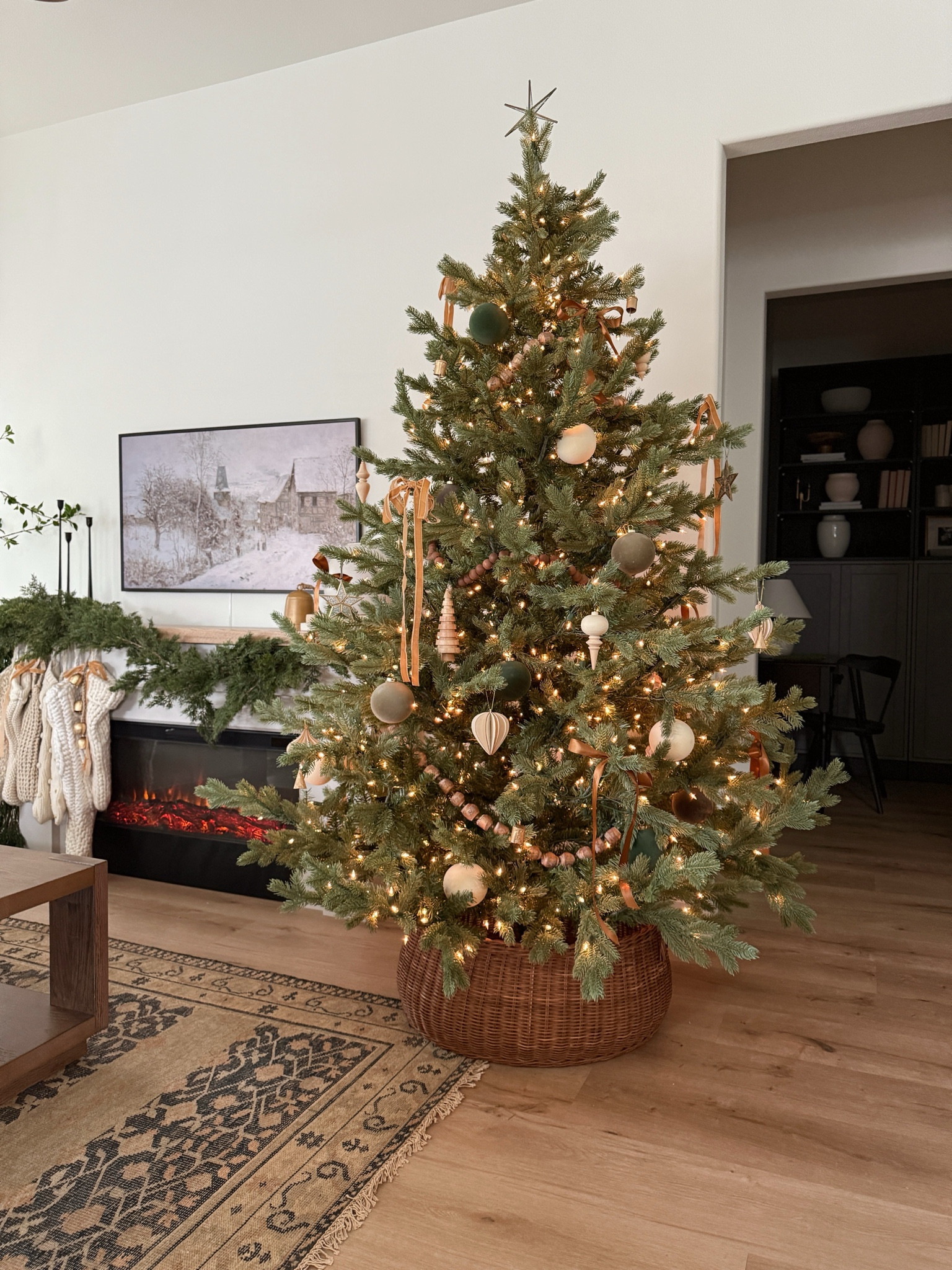 Decorate our Amazon Christmas tree with me! 🌲😍

+ I started with a bare tree (lights already installed)
+ I love adding wood bead garlands to our trees. I used 3x 6’ strands in 2 different types towards the bottom, middle and top of the tree. 
+ Next, I added larger velvet/flocked ornaments deeper in the branches to act as filler. I used browns, creams, and green ornaments.
+ Then, I added more detailed wood ornaments, stars, and bells to the edges of the branches. Various shapes and sizes really help with depth and texture. 
+ Finally, I added two different styles of bows. My $5 velvet bows from Target in a lighter brown, and darker brown bows I made with satin ribbon. 

The end! Super easy and a super pretty tree. I already plan to add a little more, but I love where we’re at for now. ☺️

Follow @frengpartyof6 for more neutral holiday home finds! 

#target #targethome #amazon #amazonhome #christmastree #christmastime #christmasdecor 

#LTKHoliday #LTKStyleTip #LTKHome