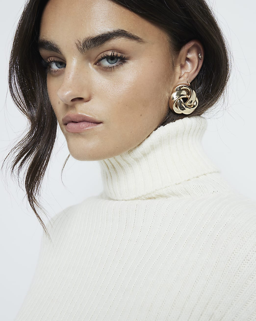 Gold swirl stud earrings | River Island (UK & IE)