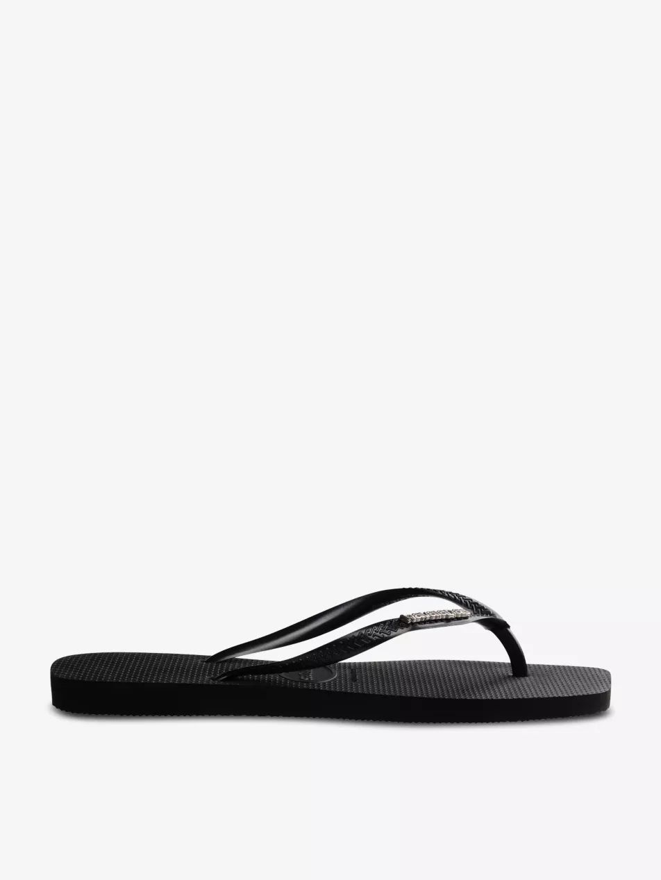 Square logo-embossed rubber flip-flops | Selfridges