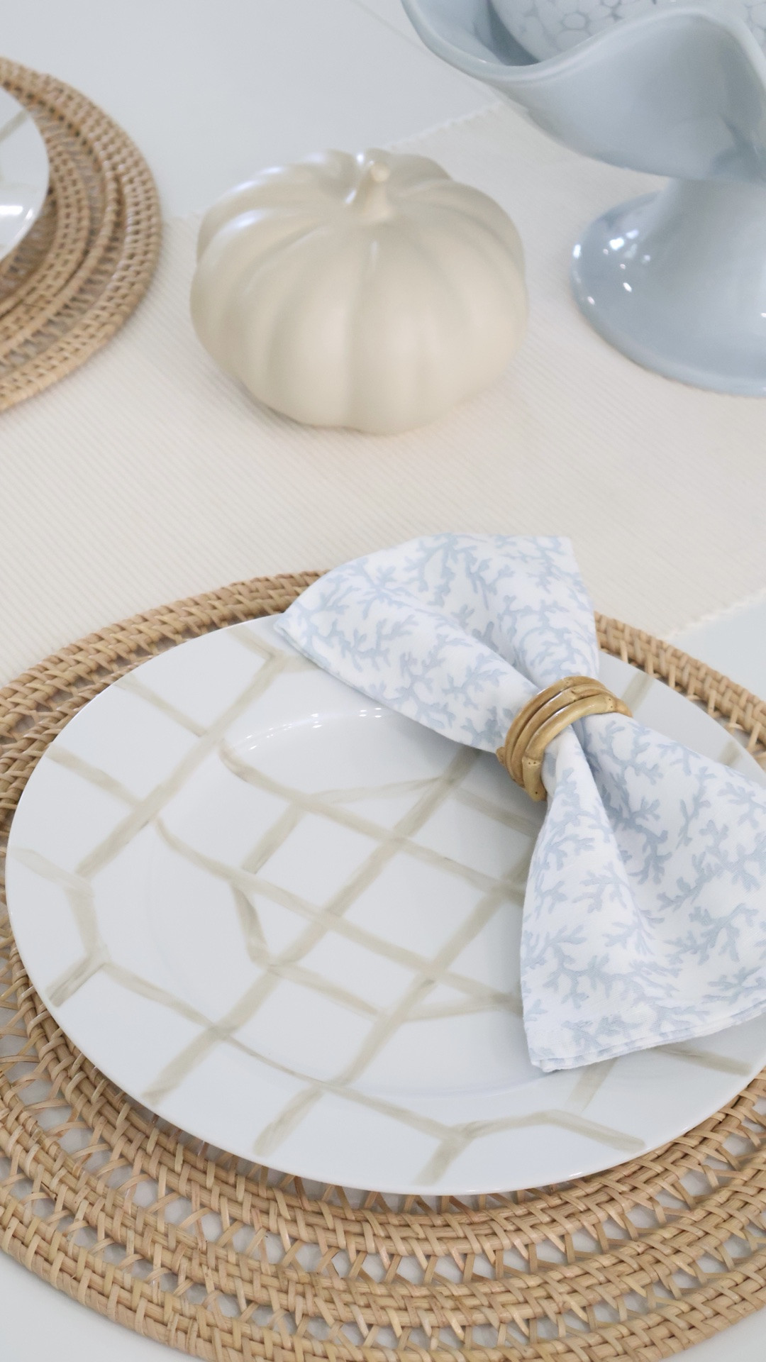 Fall table setting, but make it coastal 🍂🩵🤍 These new beige & white cane pattern dinner plates from QVC are giving the prettiest elevated coastal tablescape—and I love how they transition from summer into fall! 
Adding rattan + a little pumpkin detail makes them feel perfectly seasonal without losing that timeless coastal look.

🛒 Shop the plates and table setting decor linked below! Plates are now 38% off!

Fall Tablescape • Fall Table Decor • Coastal Home Decor • Coastal Tablescape • Blue and White Decor • Tablescape Ideas • Look for Less • Coastal Grandmillennial

#LTKHome #LTKSeasonal #LTKSaleAlert