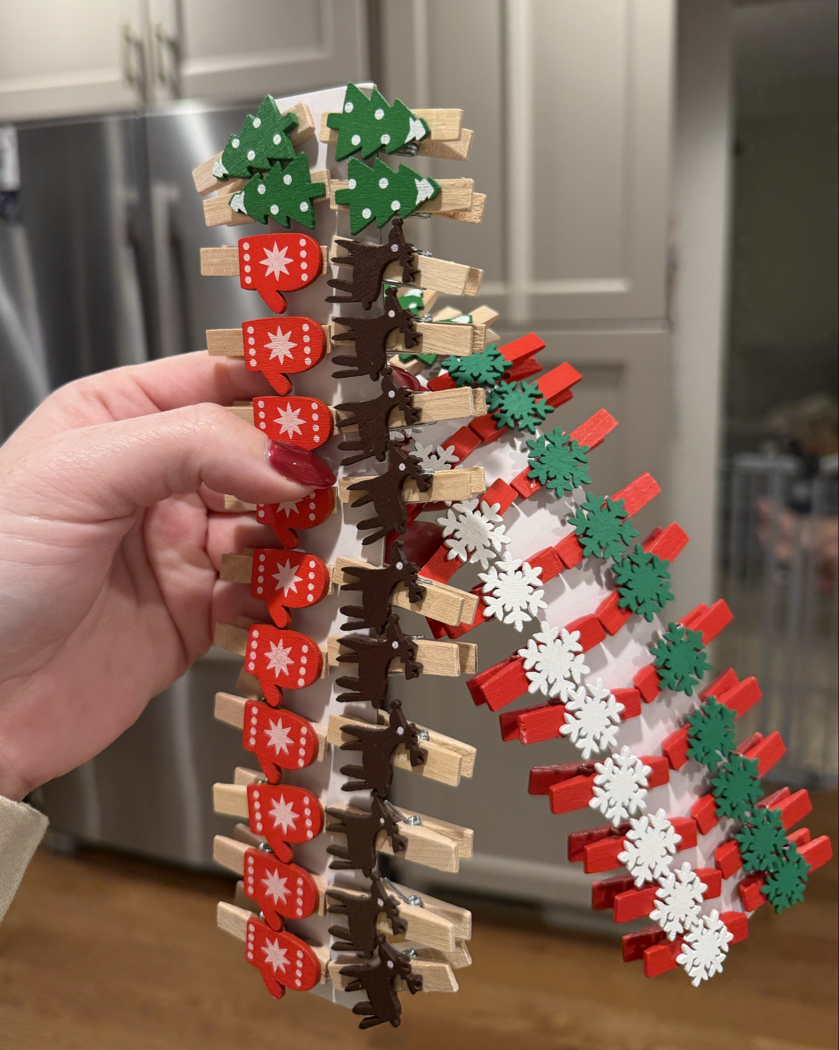 Bought these cutie clips to hang our Christmas cards up this year using the ribbon around the cabinet hack! Love how festive they are and they work perfectly! #christmascarddisplay #christmascards

#LTKHome #LTKHoliday #LTKSeasonal