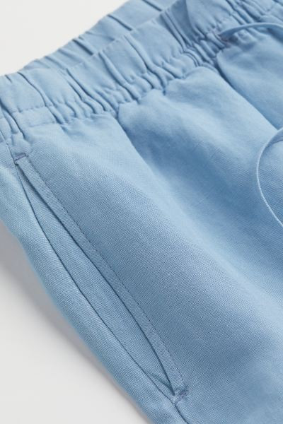 Pants in a woven linen and viscose blend. High waist, drawstring waistband with covered elastic, ... | H&M (US + CA)