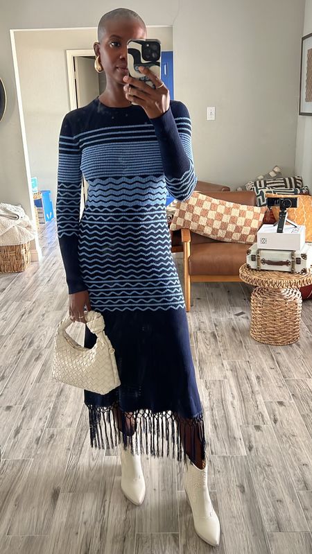 Spring dress! Blue striped long sleeve knit dress with fringe, white short western boots and worn knotted purse  

#LTKfindsunder100 #LTKshoecrush #LTKSpringSale