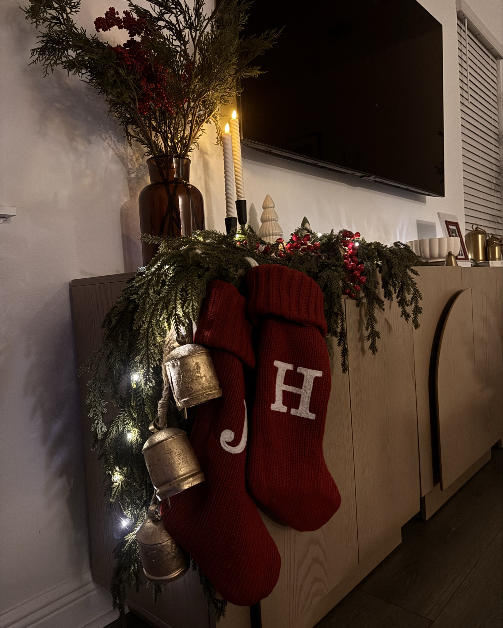 Keeping the living room cozy and filled with holiday spirit. 

I added berries and lights to the garland and I am loving how it looks and feels! 

#LTKHoliday #LTKHome #LTKSeasonal