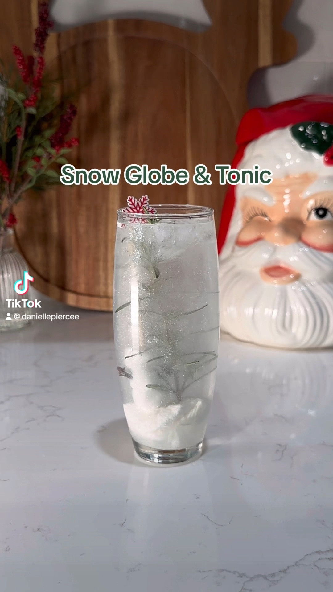 The most festive way to serve a Gin & Tonic!

Ingredients:
2 oz gin
2 oz tonic
Materials:
3 mini marshmallows
2 cloves
1 toothpick
1 rosemary spring
1 large marshmallow
Edible glitter
**once you have placed your large/mini marshmallow snowman and rosemary tree into your glass, place into the freezer for 2-3 hours! It stays colder longer and provides the WOW facor to allow your snowman to "melt" to the top

holidaycocktail - holidaycocktails thespritzeffect - holidaydrinks christmascocktails - gin ginandtonic - snowglobe easycocktail

#LTKVideo #LTKHoliday #LTKparties
