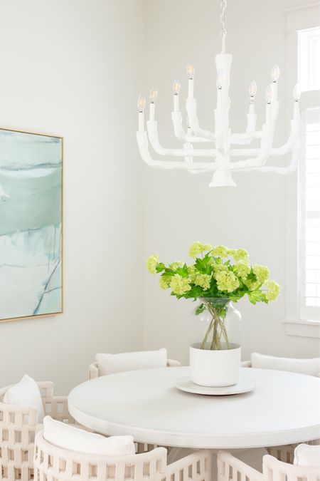 Absolutely loving these faux viburnum stems for spring! They look perfect in our coastal dining room paired with our blue abstract art, white concrete dining table, white rope dining chairs, color block vase and carved white wood chandelier! I have four sets here for this very large vase.
.
#ltkhome #ltkfindsunder50 #ltkfindsunder100 #ltkseasonal #ltksalealert #ltkover40 spring decorating ideas. Simple spring decor. Spring dining room

#LTKfindsunder50 #LTKhome #LTKSeasonal