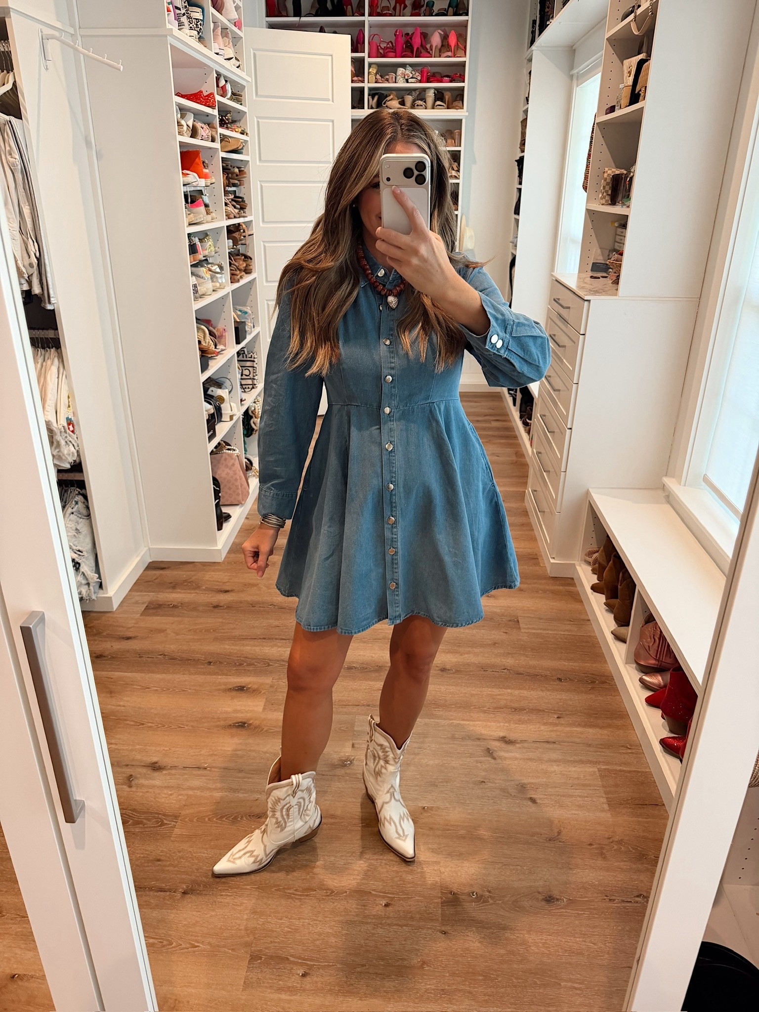 In a small denim button down long sleeve ruffle bottom dress, necklace, boots and accessories- fits tts.

#LTKStyleTip #LTKFindsUnder50 #LTKSeasonal