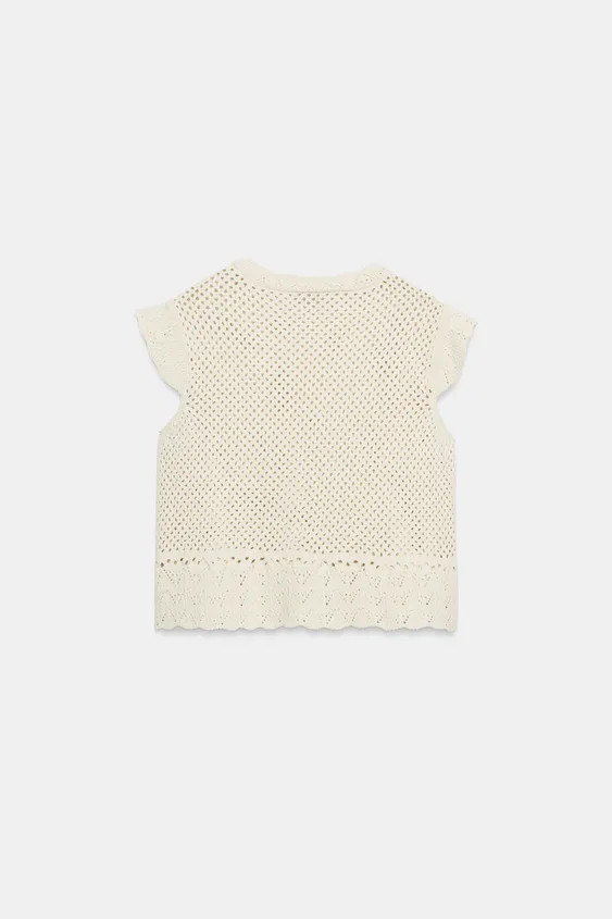 Sleeveless cutwork knit top with a round neck and ruffles. Featuring a cotton blend and a ruffled... | Zara UK