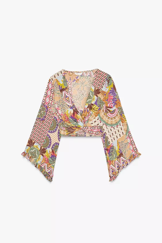 Cropped top with V-neckline, tie front, and wide flared sleeves with ruffles. Smocked back. | Zara US