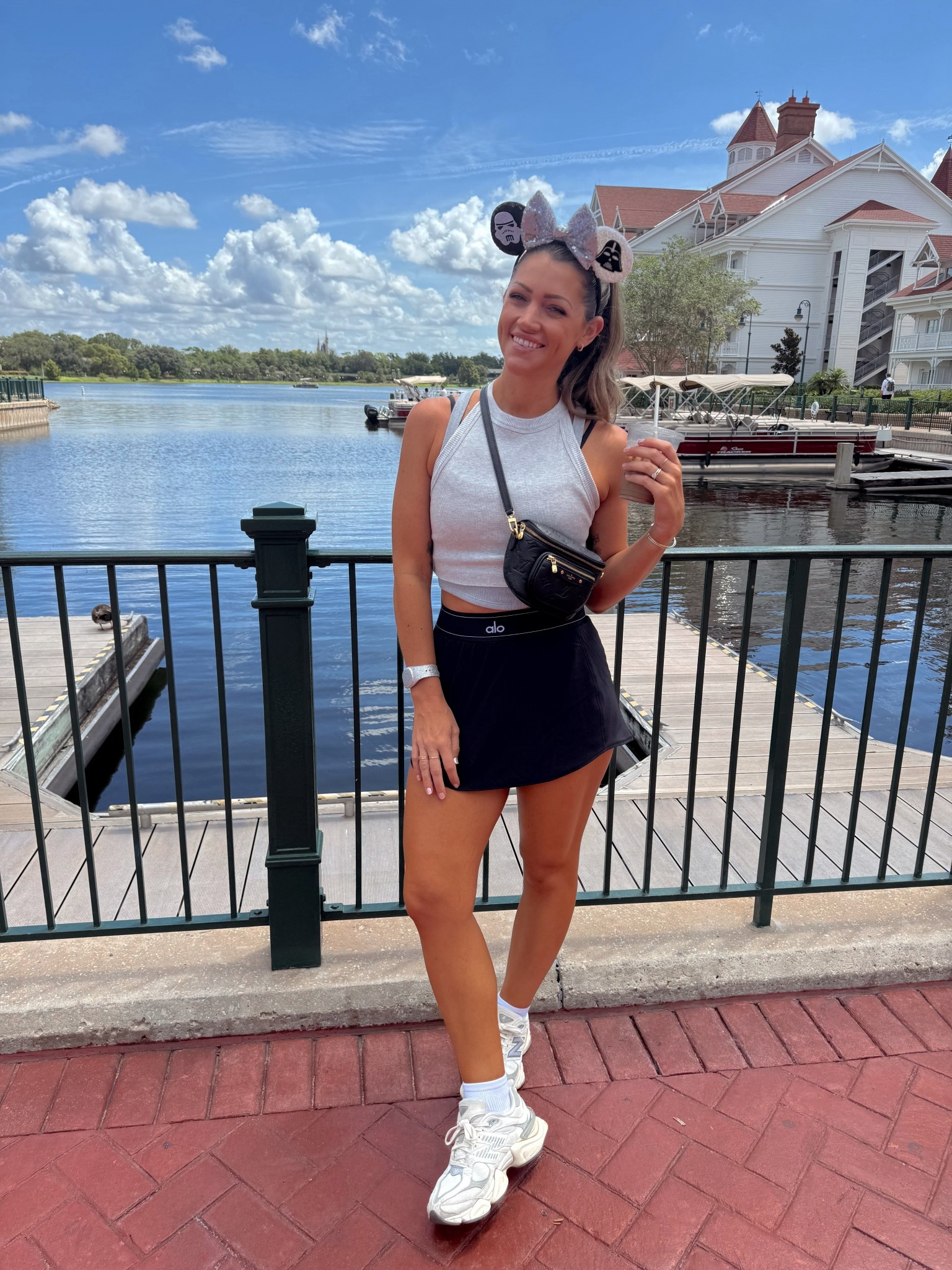 Disney outfit of the day 🖤✨🐭 
I’m in my true size S in everything! I can’t tell you how much I LOVE this skort. For my tanks: I layered the cami over my sports bra (best ever! built in padding!) and then layered the second cami from my fave FP set overtop.. I love the way the layered look turned out — so cute! + it add some extra length too since these are more cropped. 👌🏻👍🏻 #disneymoms #disneymom #disneyoutfits #athleisure #momfit #grandfloridian #disneyworld #hollywoodstudios 