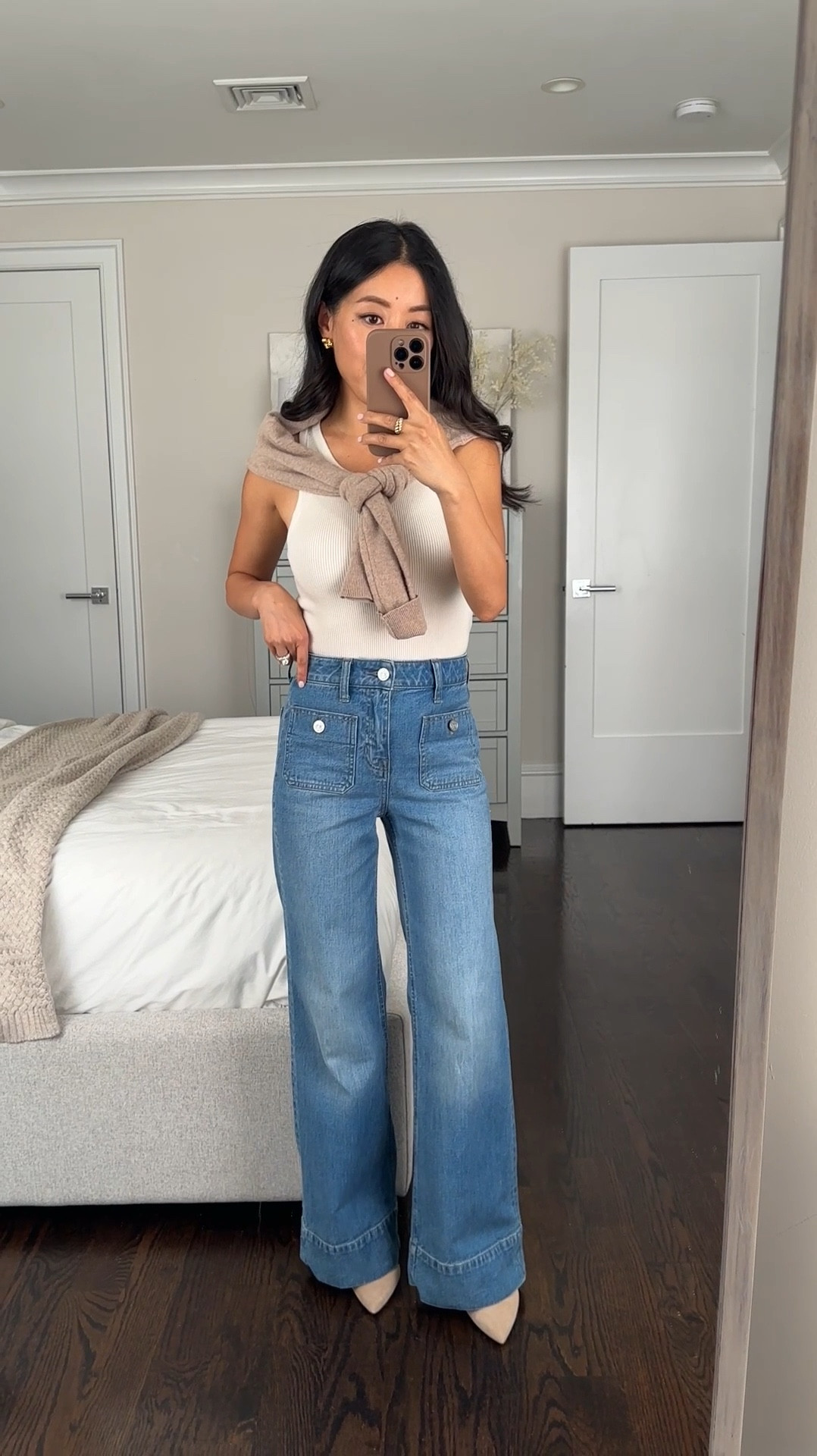 Jcrew’s two best denim styles : the denim trouser (worn here) and the slim wide jean, a cropped wider straight cut great for petites! 

• Jcrew trouser jeans restocked - I sized down to 23 petite so that it’s fitted with no gap

. Jcrew denim waist sizes run a little big for me. Very elongating and such a unique style with details from the pockets to the cuff stitching. I’m 5 feet tall and need to wear high heels with these. If you’re taller and want to wear with flats, then you could potentially try petite sizing. 

• Ann Taylor azra pump 5 older color

 • Old jcrew tank, linked similar 

• Quince cashmere sweater Xs 

Also linked the same cut denim trouser in other new colors

#LTKSeasonal #LTKWorkwear