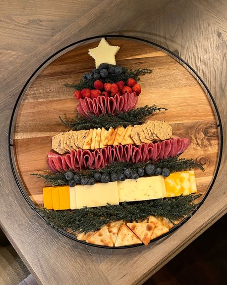 Last minute easy Christmas tree charcuterie board! I used pine from mini wreaths from the dollar spot! 💡🎄❄️ 

Charcutetree. Cheese board. Snack board. Holiday party ideas. Food ideas. Christmas party. 

#LTKparties #LTKSeasonal #LTKHoliday