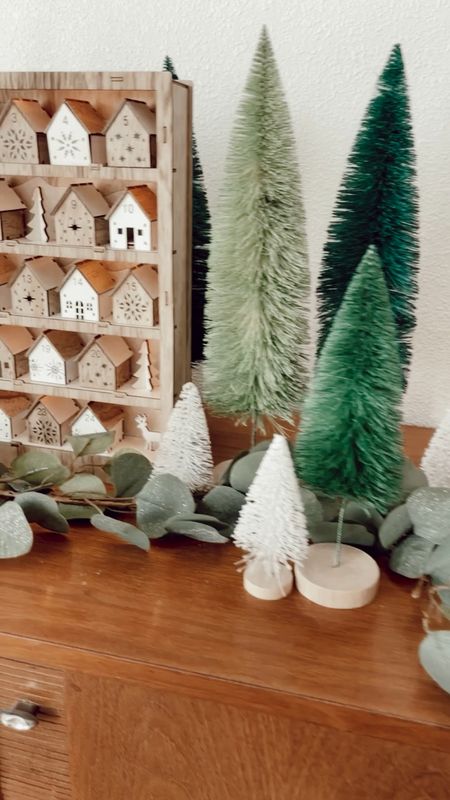 This beautiful advent calendar is a must have for Christmas decor!  Green and white bottlebrush trees - world market - Christmas garland - holiday decor - modern home decor 

#LTKunder50 #LTKHoliday #LTKhome