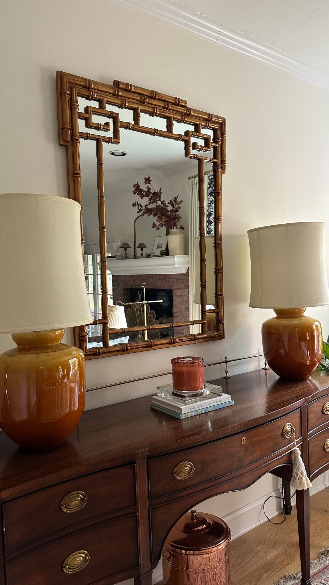 Living room decor updates. I love mixing old and new, and different styles of decor. This vintage bufffet with a more modern mirror, styled with a simple candle on some design books. And you can’t forget the tassel! 

#LTKStyleTip #LTKFindsUnder50 #LTKHome