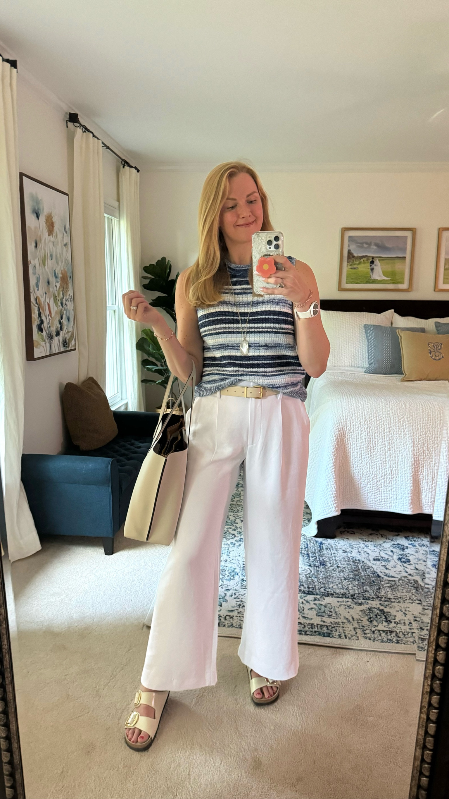 Casual work outfit idea for summer

Striped blue sweater tank - currently on sale for $18!! Fits true to size but loose. So comfy and cool for summer.

Wide leg white work pants - love the crepe material of these. So lightweight, breathable and don’t wrinkle. 

Off white/cream whjte work tote fits my laptop and has great built in compartments.

Styled with off white belt and Birkenstock sandals - both true to sizee
