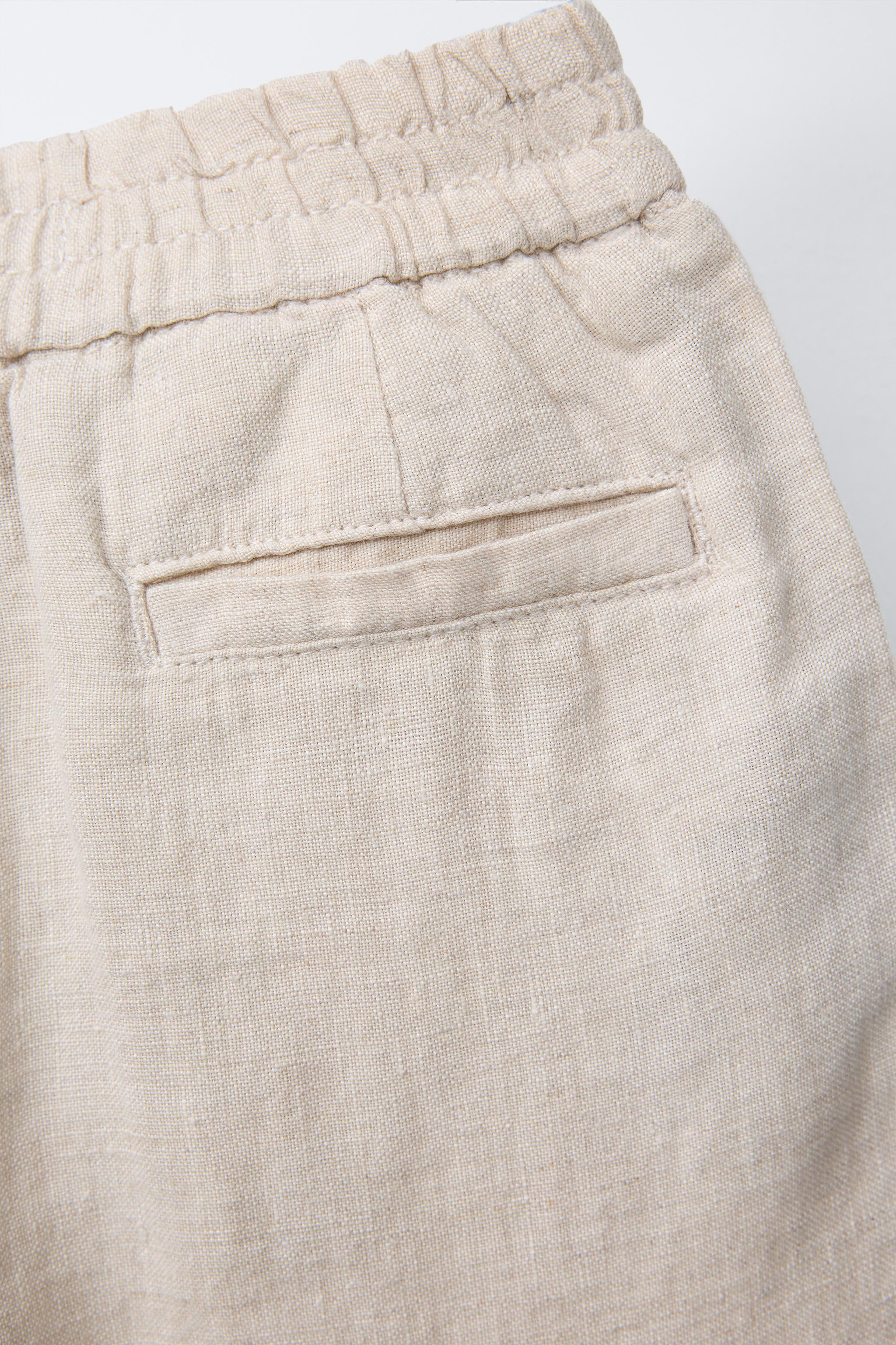 Baggy pants with elastic waistband and front button closure. Front pockets and welt detail on bac... | Zara US