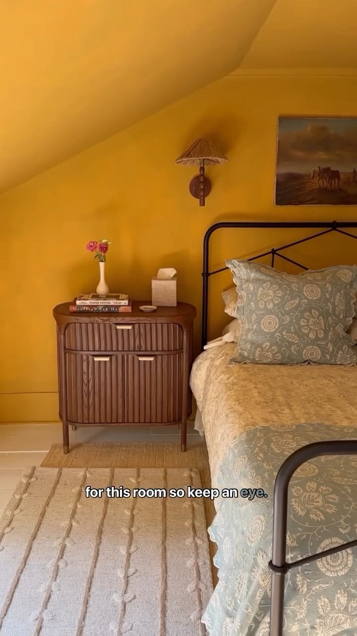 I’m tired of being a white wall person, so I’m taking action. After countless home improvements of the maintenance variety, I’m ready to give more life to what we can actually see. And I’m very excited to take you along this journey as I say goodbye to (almost) all my white walls.

PART 1– 
This is our largest guest room. It’s been a bit forgotten because it was “fine”, but it’s time for some major zhuzhing.

First things first: a lick of paint. Decided on @farrowandball’s India Yellow because it leans old world—it’s bold and cheerful but with a ton of character. 

Then I changed the details, working with @anthropologiehome on these: a stunning fluted wood nightstand in a warm, classic walnut, whimsical bedding, sconces that feel more aligned, a rug to wink at the walls, and some pretty books that are nice to both browse and read for my guests’ enjoyment.

The next phase of this room is already in the works (like, as I type this) and I can’t wait to share more. Exciting upgrades coming imminently!

All the available 🔗🔗🔗 are on my @shopmy, easy access in my profile.

#LTKCyberWeek #LTKHome #LTKstorytime