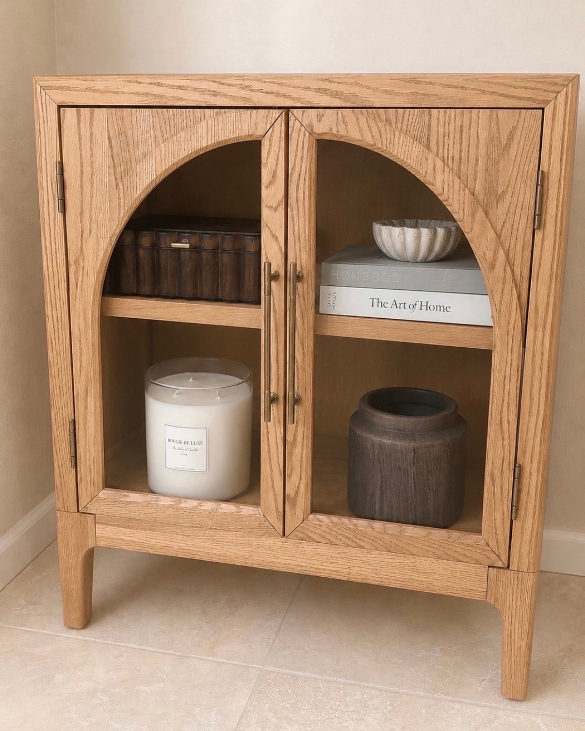 🚨 LOW STOCK on one of my favorite cabinet finds!

I grabbed this gorgeous arched cabinet on clearance and was immediately impressed when it arrived. The warm oak finish, beautiful wood grain, and arched glass doors give it such a high-end designer look in person.

✨ Hidden storage
✨ Solid oak + oak veneers
✨ Rich wood grain texture
✨ Durable kiln-dried wood construction
✨ Works as a cabinet, coffee bar, media console, or entryway piece
✨ Comes in 3 color options
✨ Matching pieces available in the collection

This is one of those pieces that instantly makes a space feel more custom and elevated. If you’ve been eyeing it, I wouldn’t wait too long since inventory is starting to get limited.

I also linked a few affordable look-alikes if you love this style but want an even lower price point. 🤎

#LTKhome #LTKfinds #homedecor #neutralhome #furniturefinds #designerlookforless #homeinspo

#LTKSaleAlert #LTKHome
