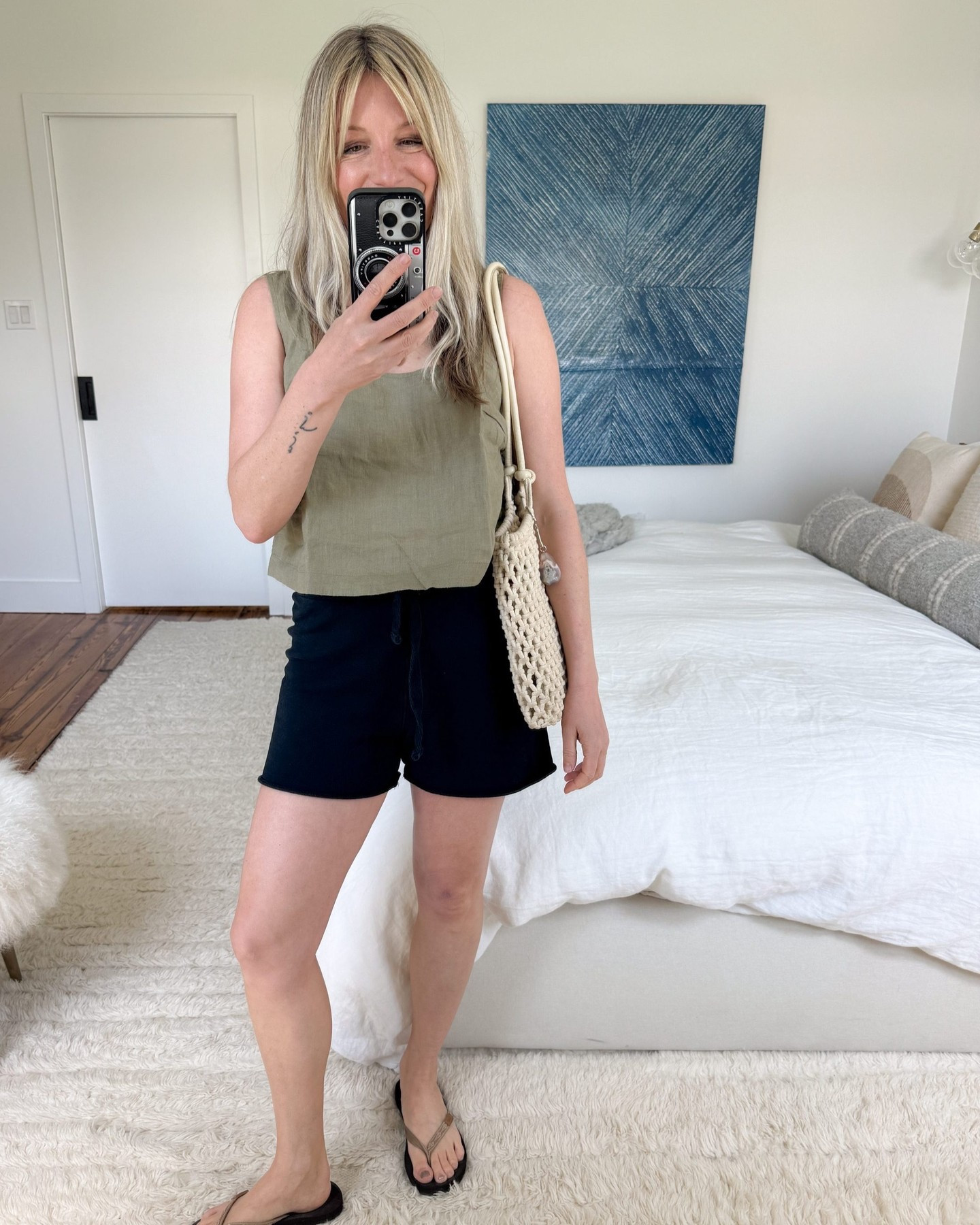 This is my new favorite linen top out of the 30 I tried. The shape is easy, flattering & hides a bra strap, too. I love the not-quite-cropped length – it means that this top never needs to be tucked in, but can still be worn with both high and lower-rise bottoms. It’s available in a solid range of pretty neutrals & the price point is great – it’s the kind of top that can be easily dressed up, but isn’t overly precious.
