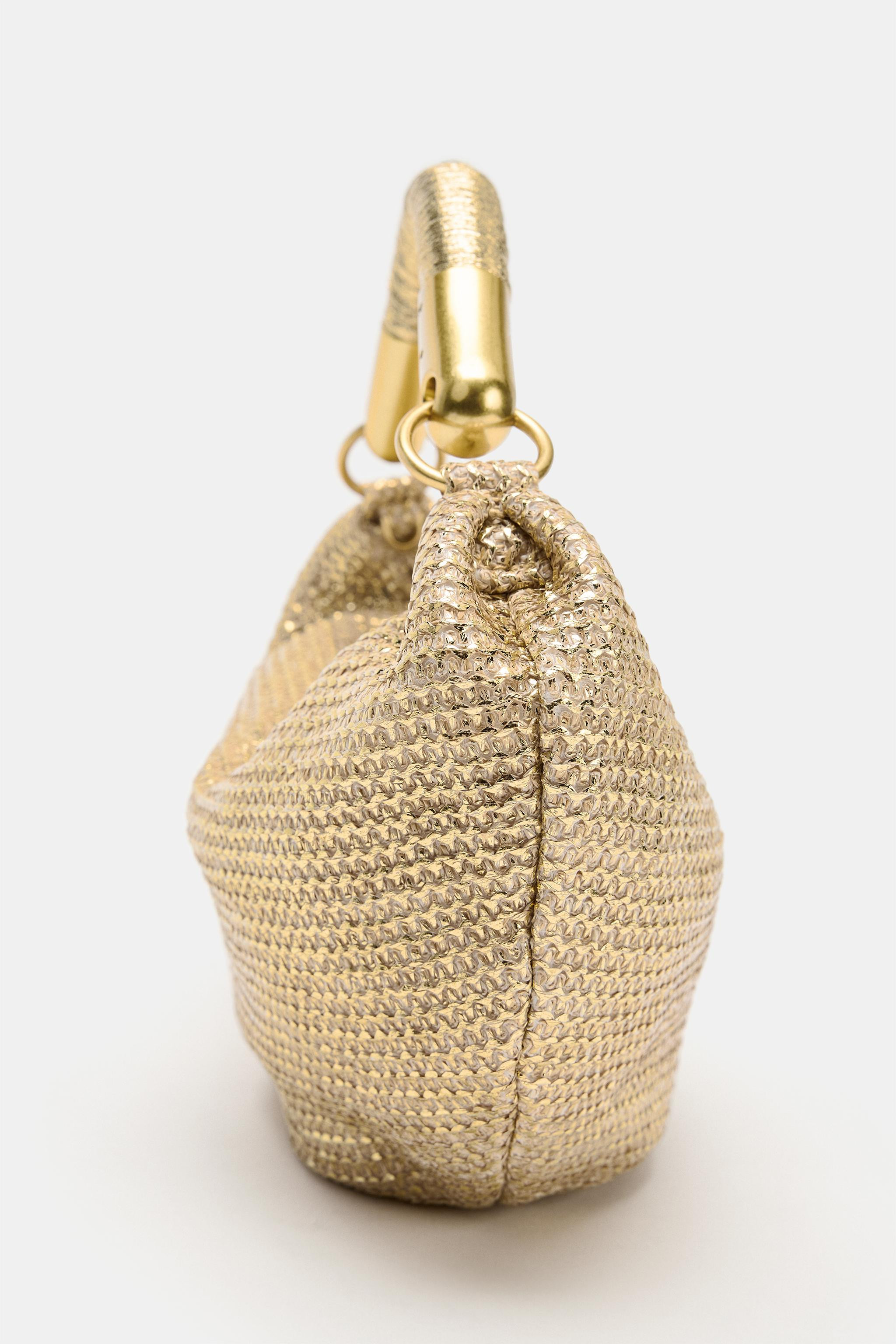 Model height: 180 cmMini bag with a metallic-effect finish. Inside zip pocket. Handle with metal ... | Zara UK