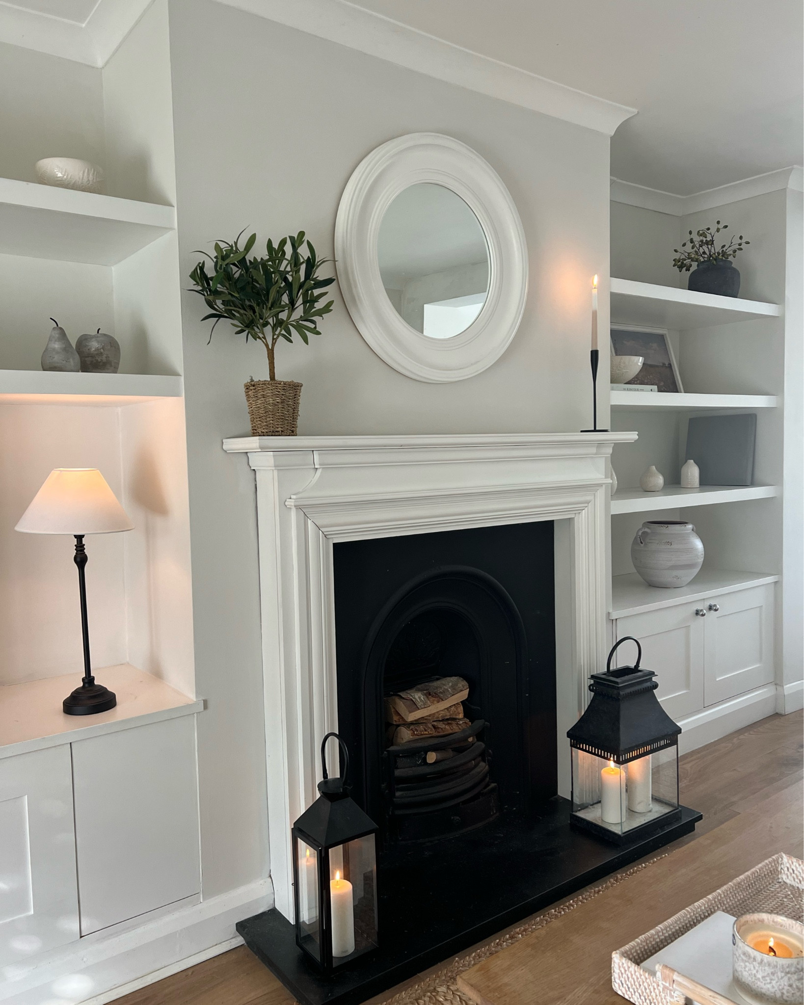 Living room details 🤍

White company mirror, white company and Wayfair lanterns, dunelm olive tree, vase and ornaments tags below.

Our fire place was a bargain find on eBay 🥰

#LTKhome #LTKuk #LTKluxury