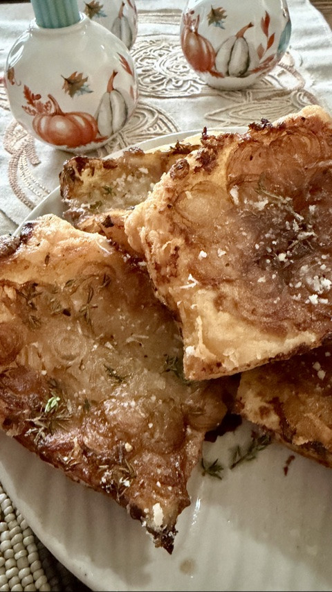 If you love French Onion Soup, wait until you try this recipe! These French Onion Soup Tart Bites have all of that savory onion and melty cheese flavor baked into the perfect little snack 🧅🧀 The best part is you only need a few ingredients to make this dish! Serve this up for game day, a fall dinner party, or even just a cozy night at home when you’re craving something warm and delicious 😋

Check out this recipe and all the details on this fun fall look below!

French Onion Soup Tart Bites

Makes about 8-10 tarts
Prep Time: 10 minutes
Cook Time: 20 minutes

Ingredients
    •    1 package frozen puff pastry
    •    1 package (about 8 oz.) small pearl onions, thinly sliced
    •    2 tablespoons olive oil
    •    2 tablespoons balsamic glaze
    •    1/2 teaspoon salt
    •    1/4 teaspoon black pepper
    •    1 tablespoon fresh thyme leaves, plus more for garnish
    •    1/4 cup grated Parmesan cheese
    •    2 tablespoons butter, melted

Directions
    1    Preheat oven to 400°F and line a large sheet pan with parchment paper.
    2    Make small piles by adding a drizzle of olive oil and balsamic glaze for each tart. Sprinkle with salt, pepper, and fresh thyme, then layer a few slices of pearl onion on top. Finish each pile with a sprinkle of grated Parmesan.
    3    Cut the puff pastry into 8–10 small squares, making each piece large enough to completely cover the onion mixture. Place one piece of puff pastry over each pile and gently press down around all four edges.
    4    Brush the tops of the puff pastry with melted butter.
    5    Bake for approximately 18–20 minutes or until the puff pastry is puffed and golden brown.
    6    Let the tarts cool on the pan for a few minutes, then carefully flip each one over so the caramelized onion and Parmesan mixture is facing up.
    7    Finish with additional fresh thyme, Parmesan, or your favorite garnish and serve warm. Enjoy!

#LTKfoodie #LTKSeasonal #LTKHome