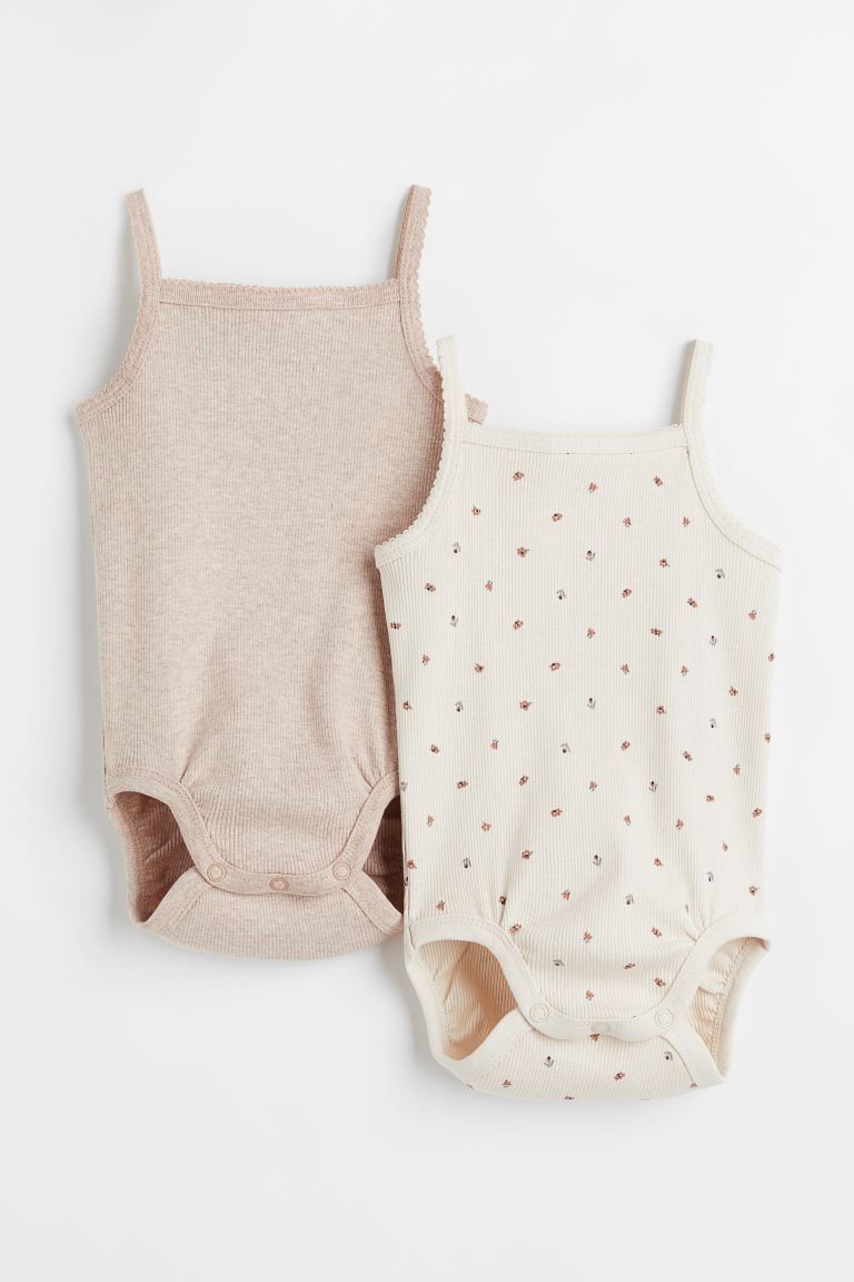 BABY EXCLUSIVE. Sleeveless bodysuits in soft, ribbed organic cotton jersey. Narrow shoulder strap... | H&M (US + CA)