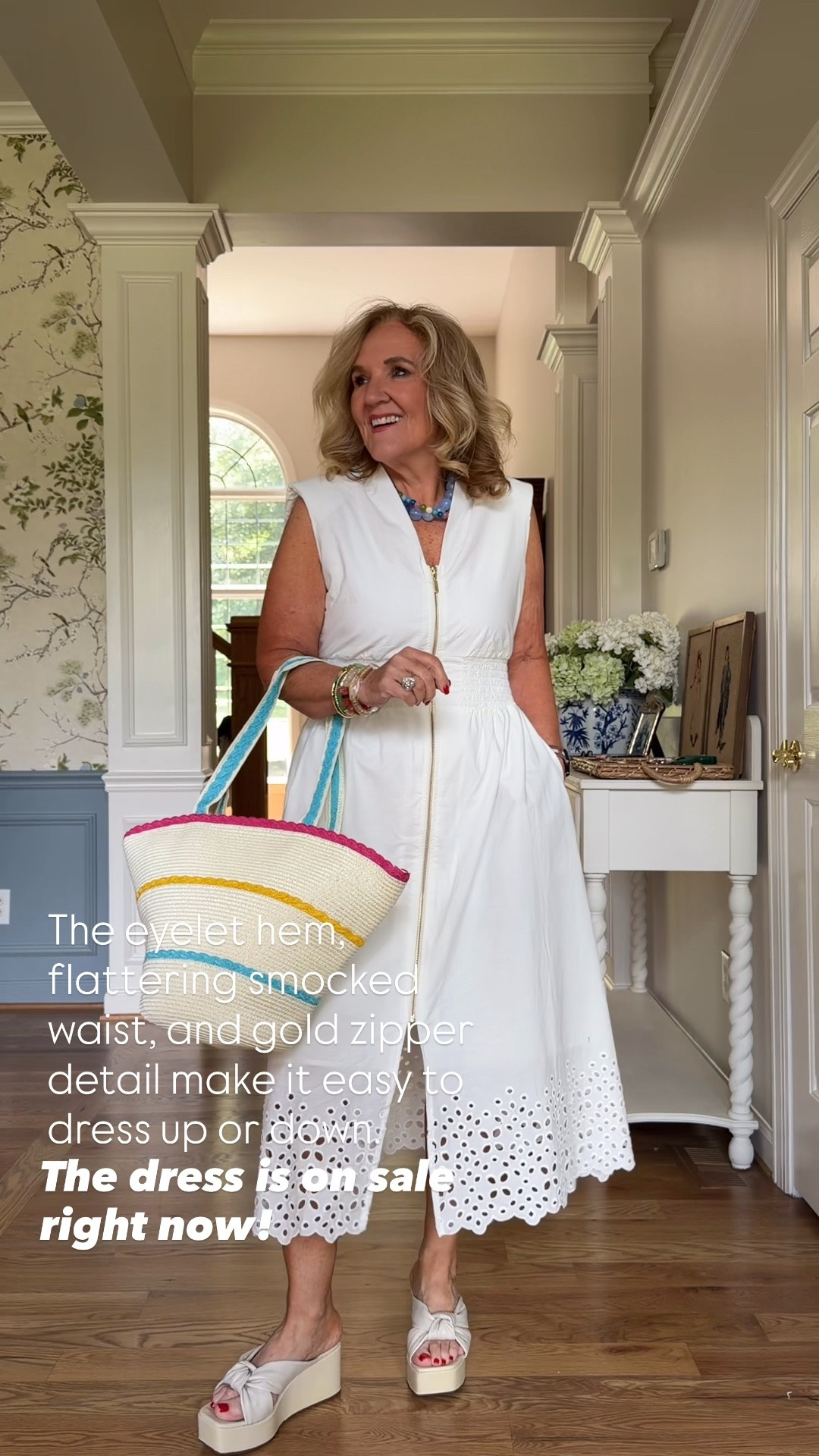 The eyelet hem, flattering smocked waist, and gold zipper detail make it easy to dress up or down. Even better, the dress is on sale right now, making this the perfect time to refresh your summer wardrobe. I paired it with a colorful woven tote for an effortlessly chic look you'll wear all season.

💡 LTK MADE EASY ❤️ Heart = Support my posts! 🔖 Save = Get sale & restock alerts 📋 Lists = Keep favorites organized 📲 Share = Send lists and products to a friend. Hello, Christmas List! 💬 Comment = Ask me anything about sizing or fit. :-)

#LTKootd #LTKOver40 #LTKSaleAlert