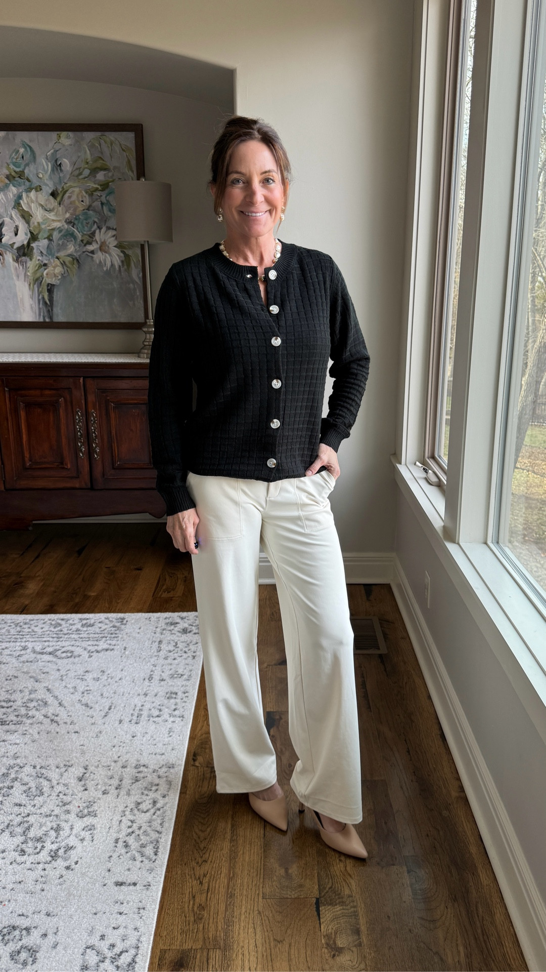 This sweater is one of those easy, polished pieces that instantly elevates an outfit. The texture and button detail give it structure without feeling stiff, making it perfect for everyday wear or casual dress-up. It layers beautifully but also stands on its own as a statement top. 

I styled it here with yoga trouser pants for a comfortable, streamlined look that still feels put together.

Fit notes: sweater runs true to size with a relaxed but flattering fit.