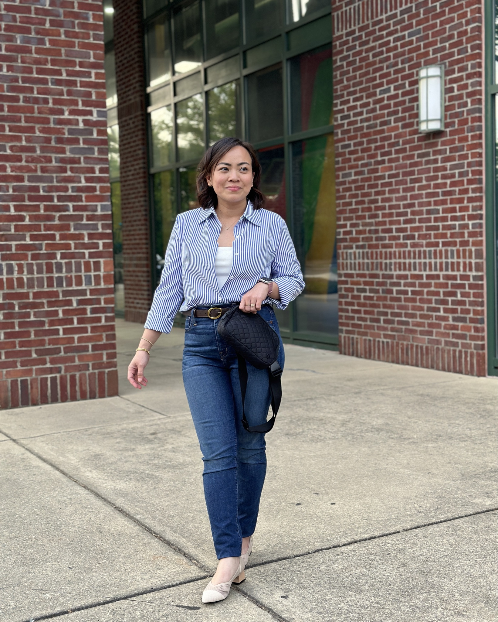 Roll up the sleeves of the blue striped button-up dress shirt to the elbows for a relaxed vibe, then tuck it loosely into the skinny jeans for a laid-back yet polished look. Pair it with the pointed chunky heel pumps to add a touch of sophistication.

#LTKxMadewell