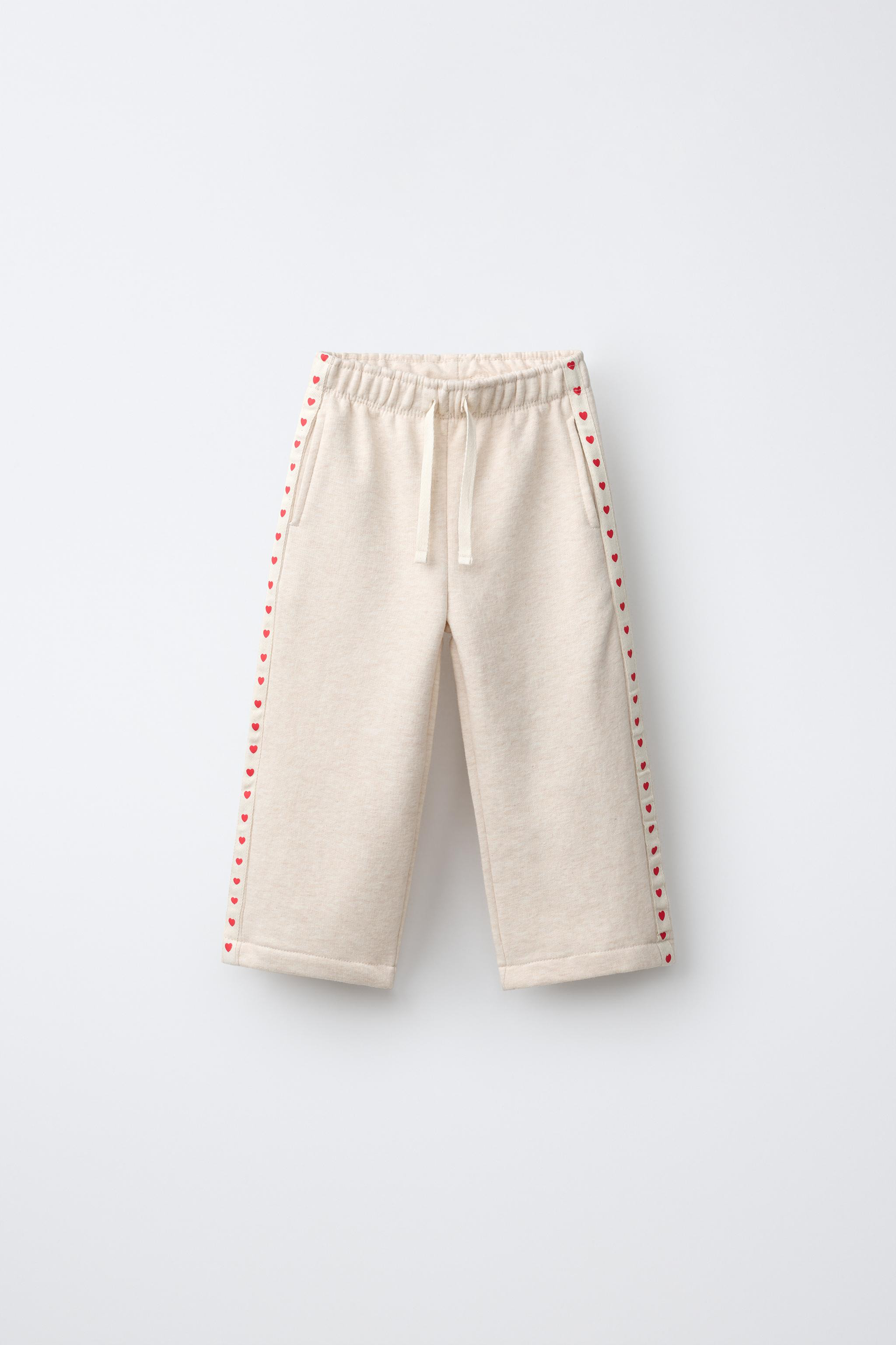 Wide leg pants with an elastic waistband and front drawstring detail. Front pockets. Heart-print ... | Zara US