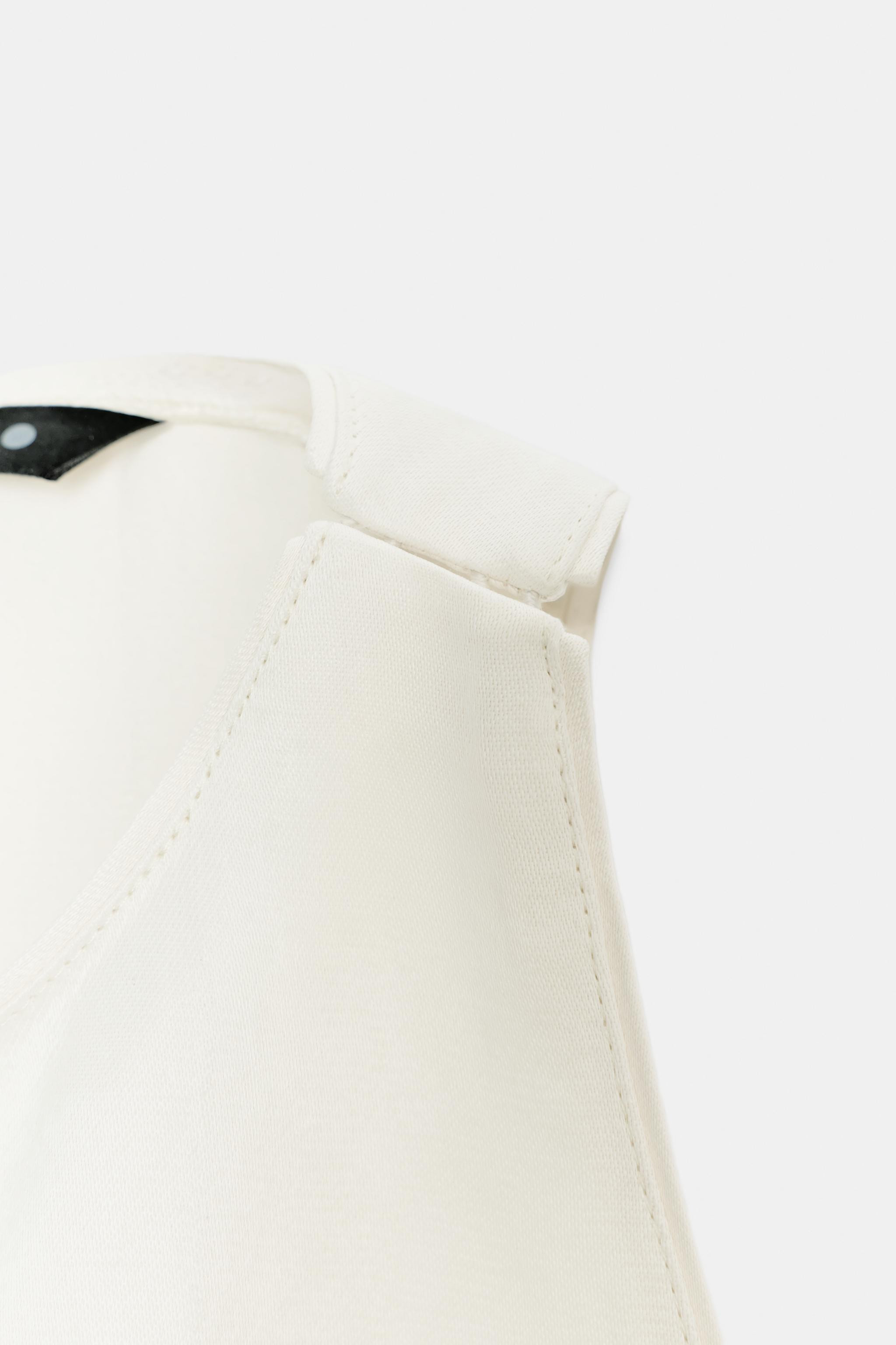 ZARA WOMAN COLLECTIONTop made with 14% linen blend yarn. Round neckline and racerback. Asymmetric... | Zara US