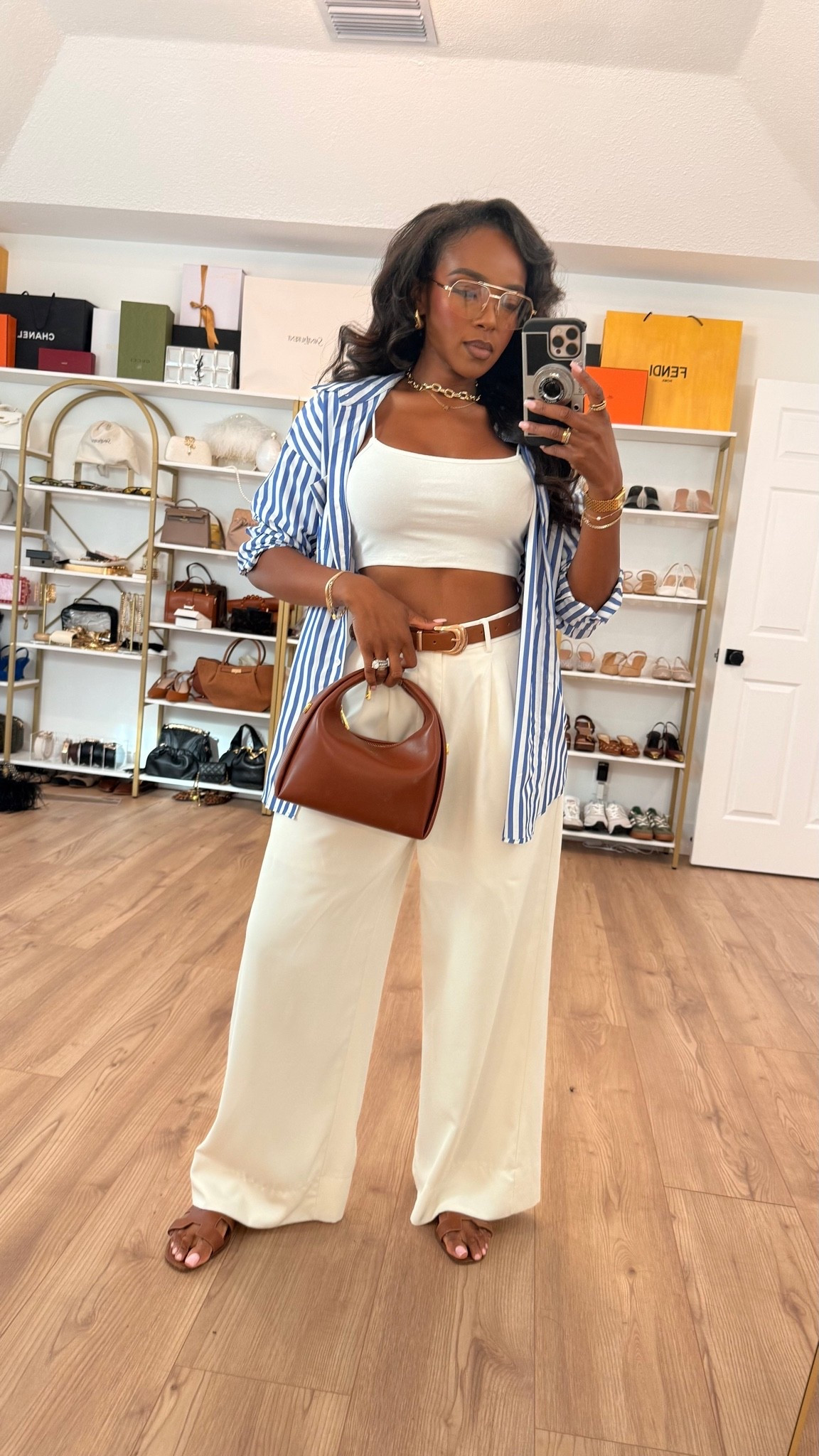 Hi Babes!

The easiest way to look effortlessly put together this summer 💙✨

A striped button-down, white tank, and flowy trousers will never go out of style. I love how the blue stripes add just the right pop of color while the neutral accessories keep everything looking polished and expensive. This is one of those outfits you'll reach for over and over again.

Where to wear this:
• Weekend brunch
• Vacation sightseeing
• Casual office day
• Lunch with friends
• Travel day

Undergarments: Nude seamless bra and underwear recommended.

Everything is linked below!

xx Kira | IG: KirasFashionFinds

34D - 27 - 40 • Size Small or 4