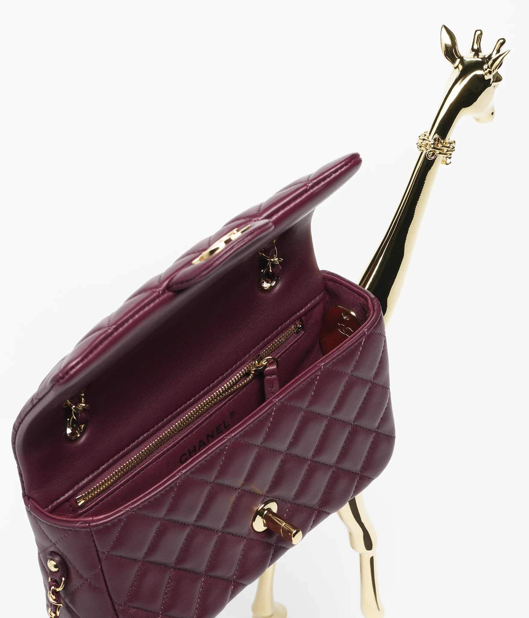 MÉTIERS D’ART 2026
 
MINI FLAP BAG
 
Lambskin & Gold-Tone Metal 
Dark Burgundy
 | Chanel, Inc. (US)