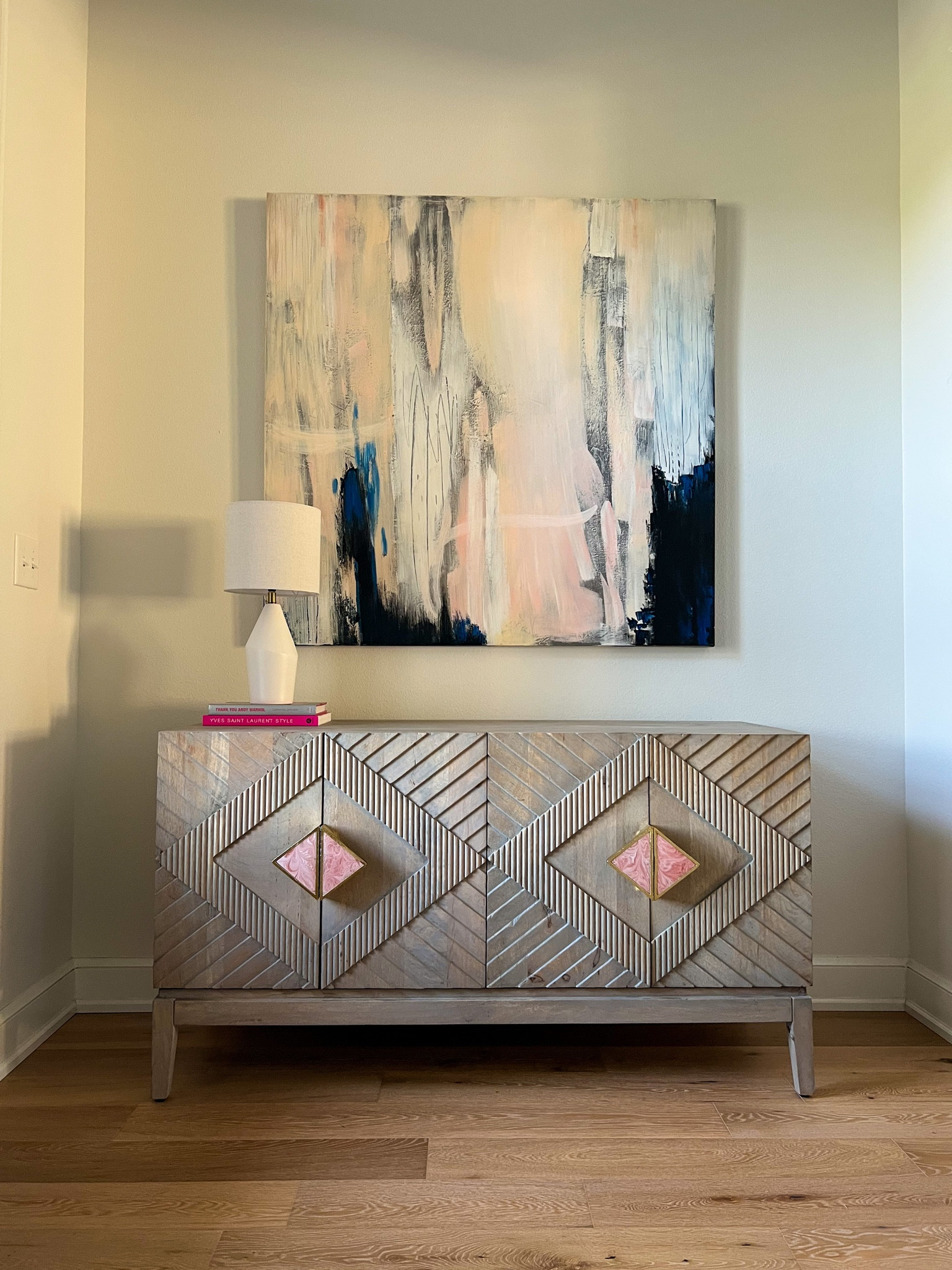 The side board is on sale a major 33% off. I love the little details in the texture and rosy handles. I have a light strip on the back of it and this little lamp adds the perfect ambiance to my space in the evening. Great for an entryway, dining buffet, or tv cabinet. 

Interior decorating, home, anthro living, sideboard 

#LTKsalealert #LTKhome