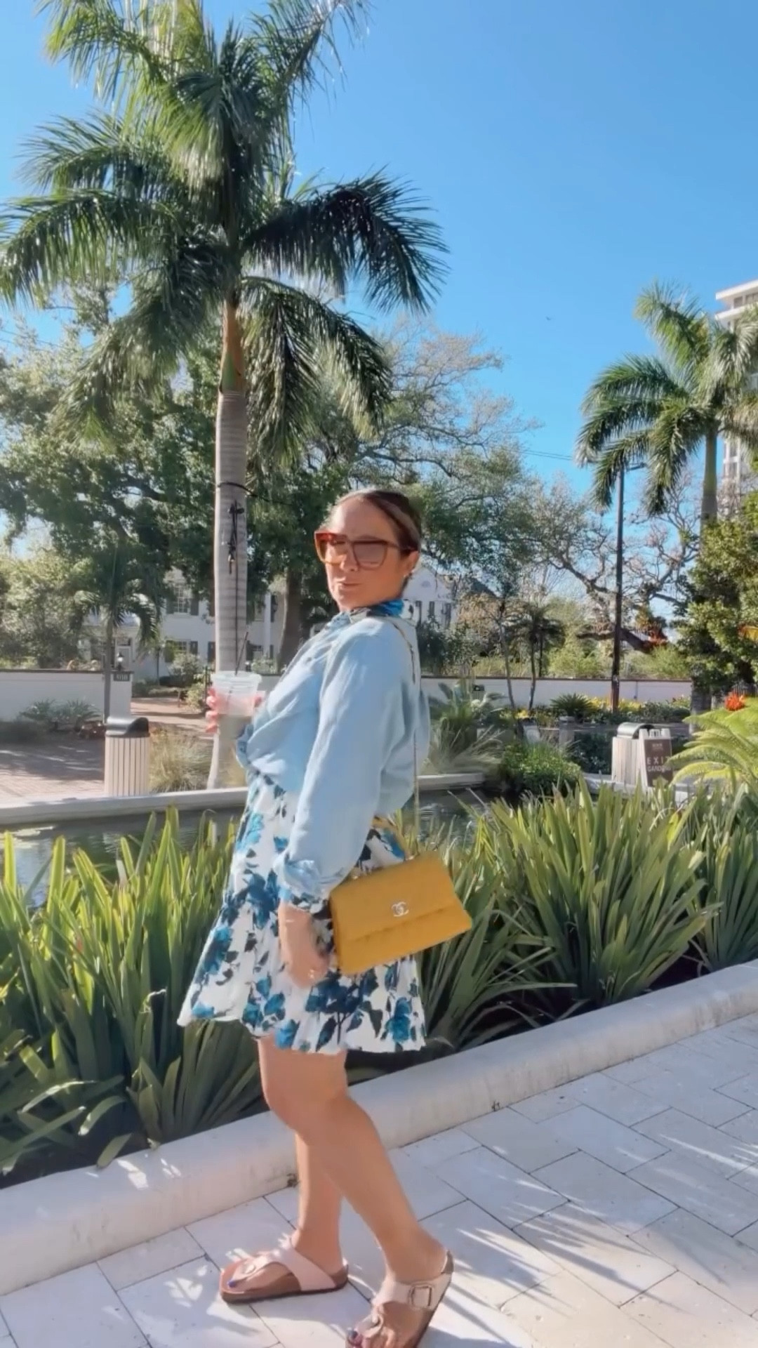 Spring Blues (and Yellows) 💙☀️This weather calls for layers, and one of my favorite styling tricks is turning your dresses into skirts with button-downs tied at the waist. This combo was super easy and effortless - and frankly, a last-minute decision, but I’m glad it worked out 😎 Shirt @sezane Dress @caracara_nyc Bag @vivrelle x @chanelofficial Sunnies @diffeyewear x @influencestyle Shoes @birkenstock x @anthropologie Sea Foam Latte @toastique x @laura.eats.srq
