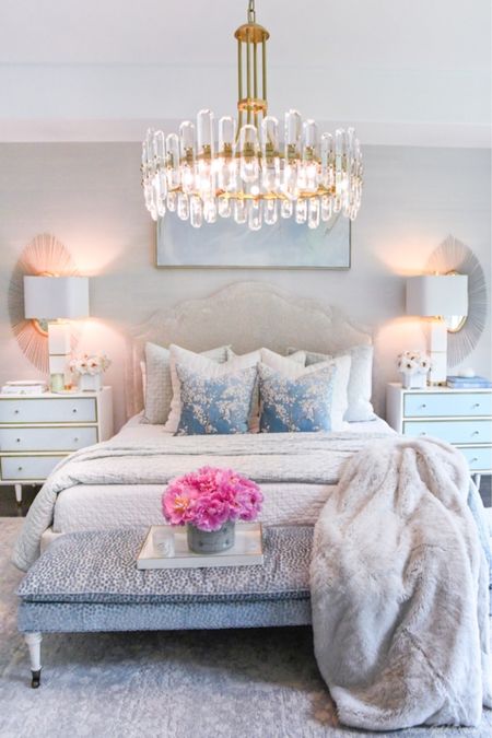 Primary bedroom with statement chandelier. Coverlet, shams, decorative pillows in spring colors. Beautiful soft blue area rug 💕

#LTKhome