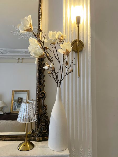 Faux magnolia branches for spring, white bees, cordless mini lamp, gold wall sconce, Primrose, mantle mirror

#LTKhome #LTKSeasonal #LTKFind