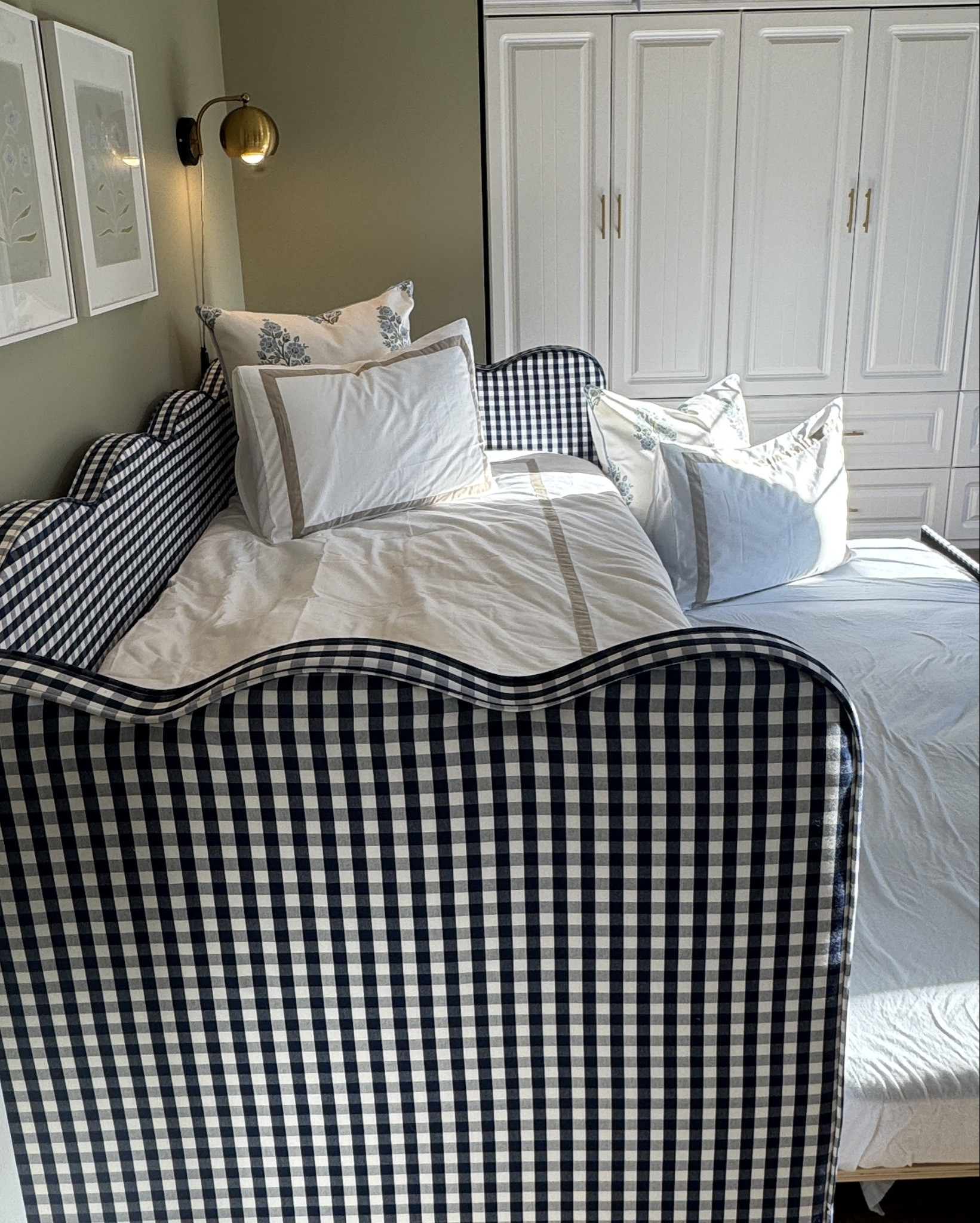 This fourth bedroom has worn many hats for us—closet, home gym, family hangout, and now the perfect guest space—and this daybed from Wayfair is what finally made it all click. It’s a twin daybed that doubles as a sofa for movie nights, has a second twin tucked underneath for guests (or kids!), and can even convert into a king when we’re hosting a couple. Smart, space-saving, and so versatile.
I also want to note the bedding is from Wayfair too. I have this same duvet cover and shams on my own bed and knew it would be perfect here. I chose the beige trim this time—it complements the art so beautifully and adds that subtle grandmillennial touch. Plus, it’s cotton sateen (my favorite): silky, cool to the touch, and still breathable.
And don’t skip the details—the wire plug-in sconces are also from Wayfair and were the perfect solution since we don’t have room for nightstands. They have an easy little clicker you can reach from bed and add the prettiest evening glow.
From sofa beds to smart lighting, it’s all about pieces that make every inch count ✨ #ad

#wayfairpartner #Wayfair #NewYearNewYou @wayfair 

#LTKHome