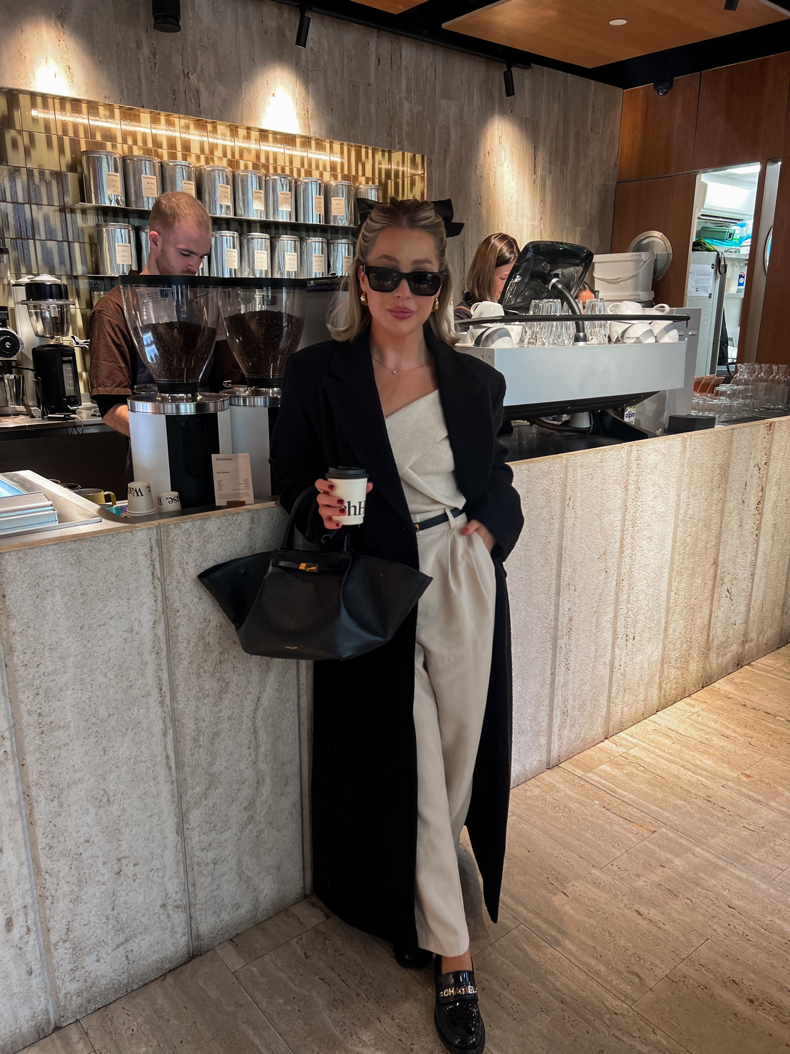 Black long wool coat, cream tailored trousers, gold hoops, hair bow, cream off the shoulder knit top, pretty lavish, weekday, h&m 

#LTKeurope #LTKSeasonal #LTKstyletip
