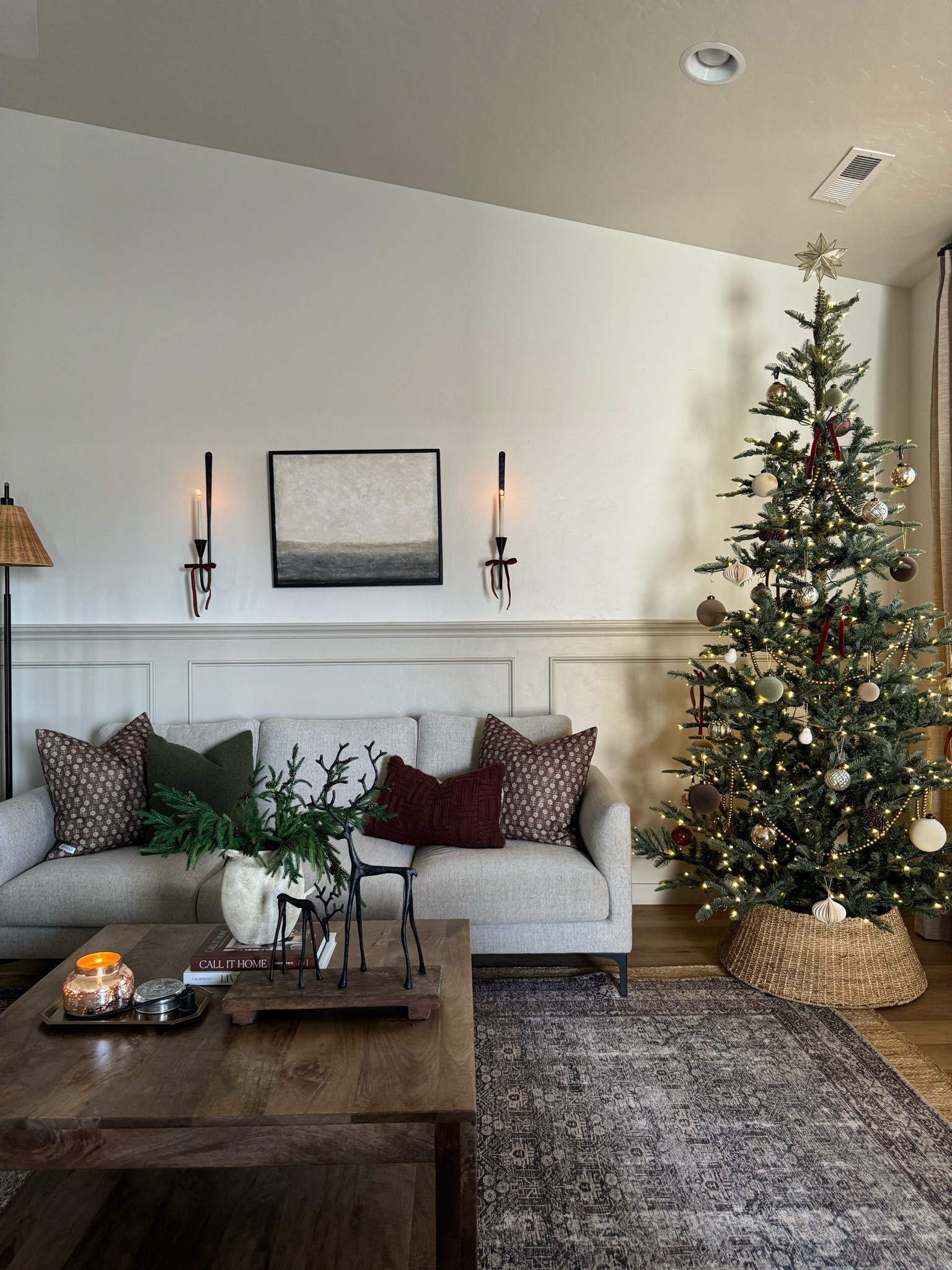 Living room inspo, custom curtains, pinch pleat curtains, floor to ceiling curtains, neutral sofa, beige sofa, west elm penn chair, green accent chair, vintage pillows, Turkish pillows, boucle pillow, shady lady tree, faux tree, greenery, Walmart floor lamp, rattan floor lamp, round coffee table, wall sconce, tapered candle holder, leather sofa, shady lady tree, loloi Sinclair rug, throw pillows, floor length mirror, arch mirror, Target home decor, affordable home, black cabinet, studio McGee cabinet, round glass coffee table, target accent table, Sinclair loloi rug, vintage inspired rug, vintage milking stool, foot stool

#LTKstyletip #LTKHoliday #LTKhome