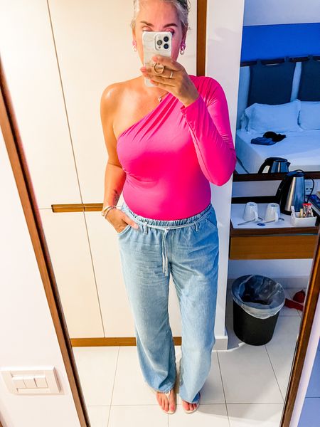 This hot pink asymmetric bodysuit is from Zara (L) as are the wide legged soft blue jeans (EU42). Both are current but can’t be linked, which is why I linked similar items. 



#LTKstyletip #LTKeurope #LTKtravel