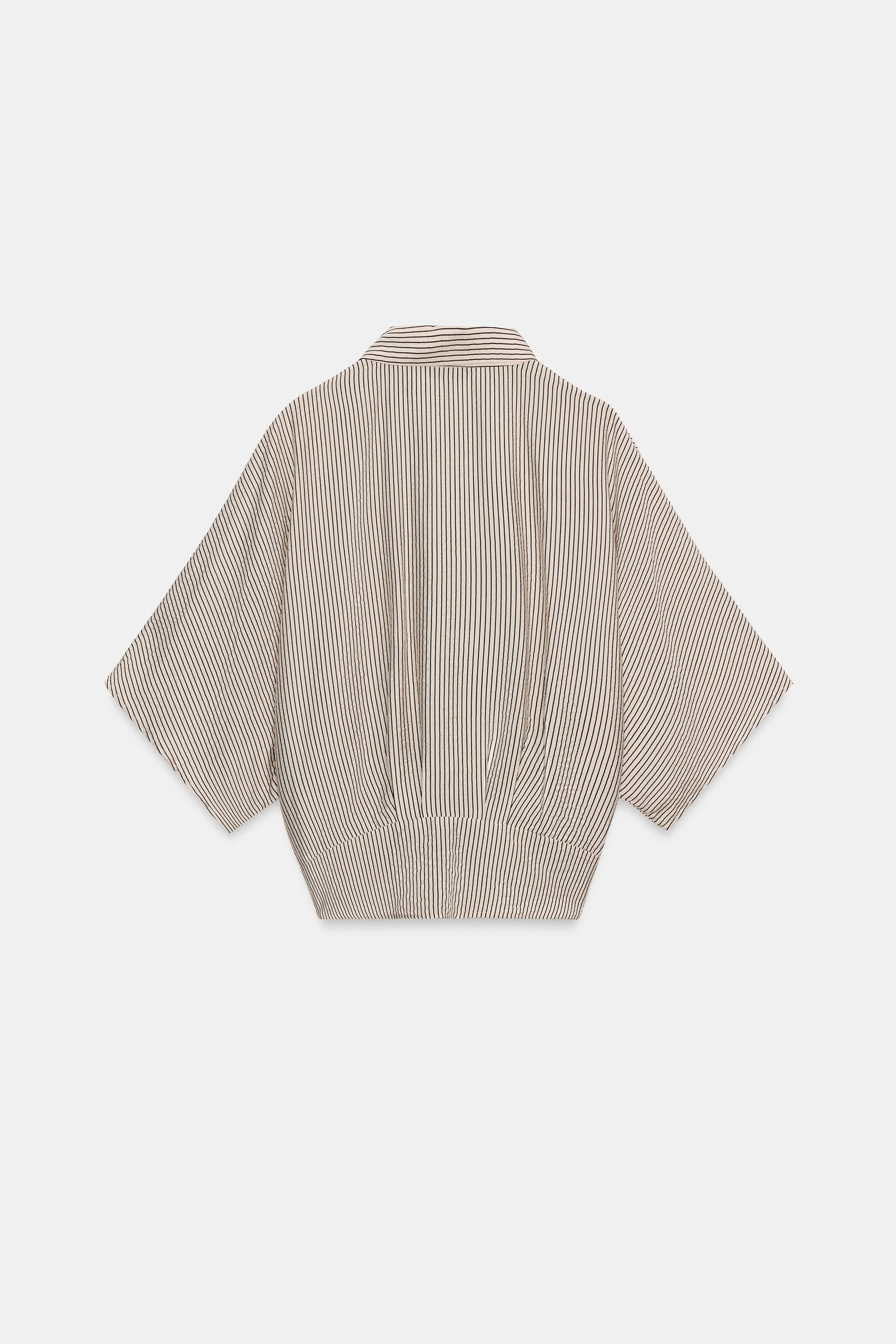 Collared short sleeve shirt with a tie detail at the hem. Front button fastening. | Zara US