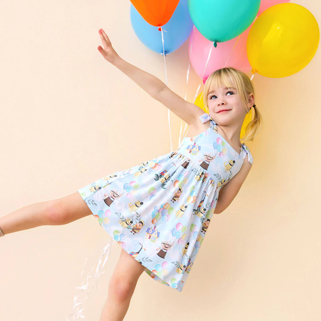 Pixar Blue Girl Disney Pixar’s Up Bow Babydoll Dress | Posh Peanut® | Posh Peanut